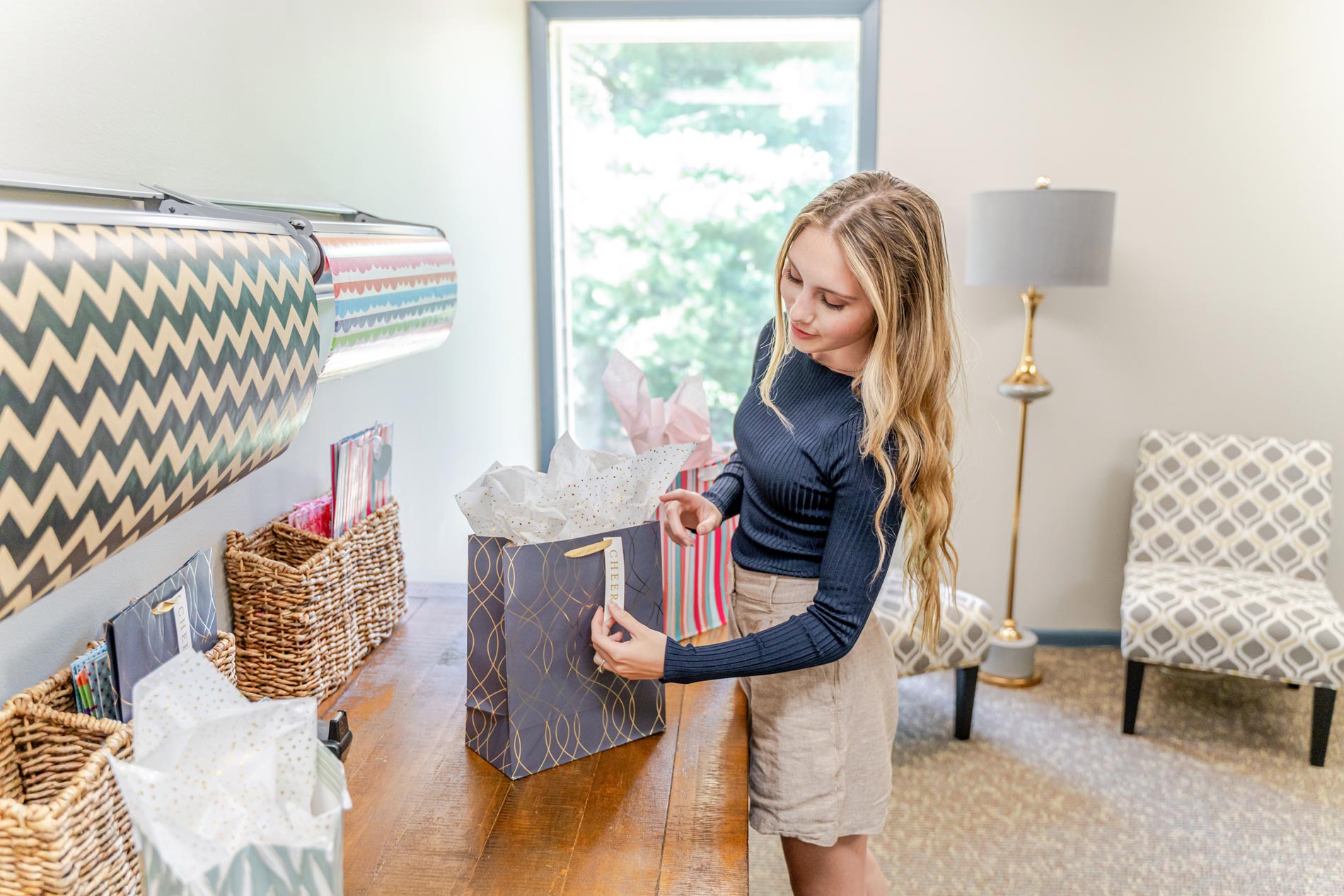 Legacy Hill woman wraps present 