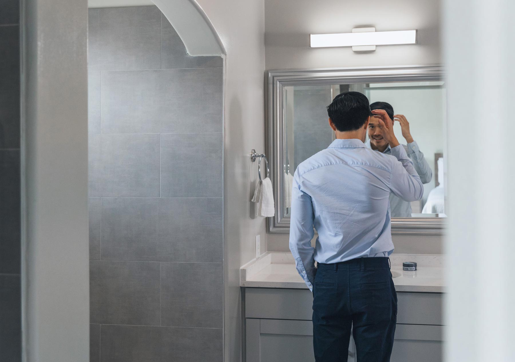 Lenox Farms man does hair in bathroom