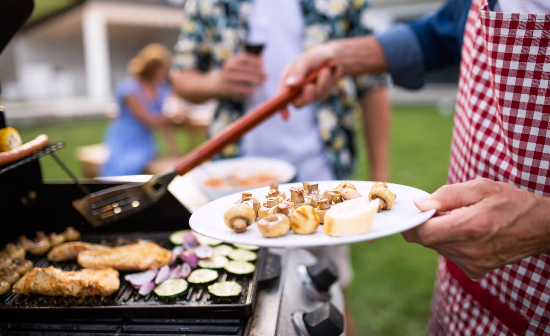 Person grilling outside