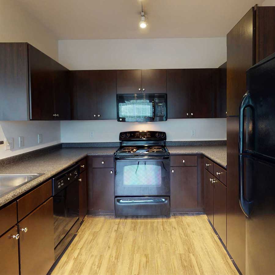 Lodge at Ames Pond apartment kitchen walnut on grey finish package