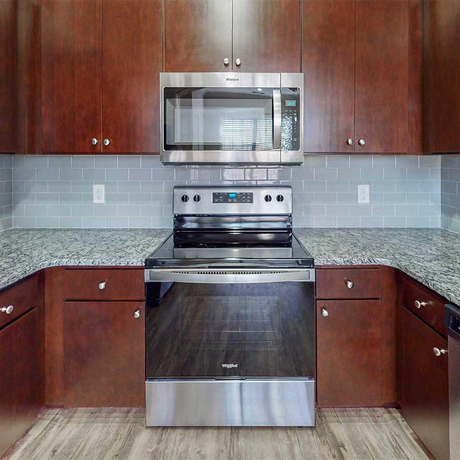 Lodge at Ames Pond apartment kitchen walnut on granite finish package