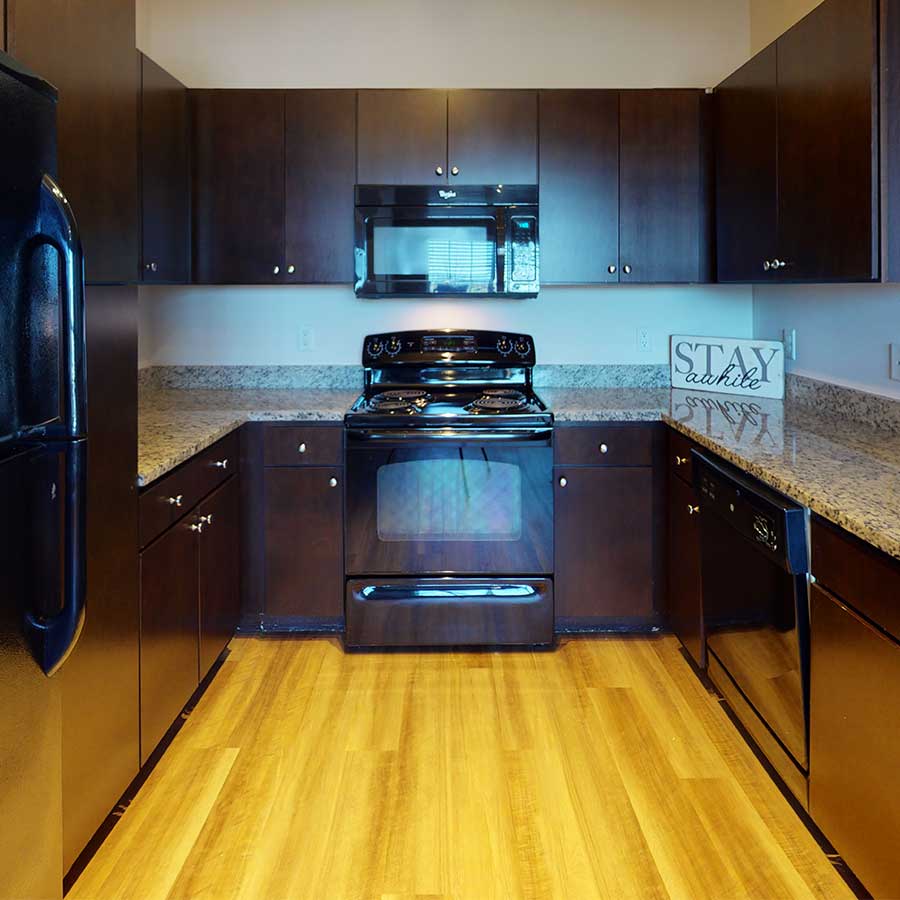 Lodge at Ames Pond apartment kitchen walnut on marbled finish package