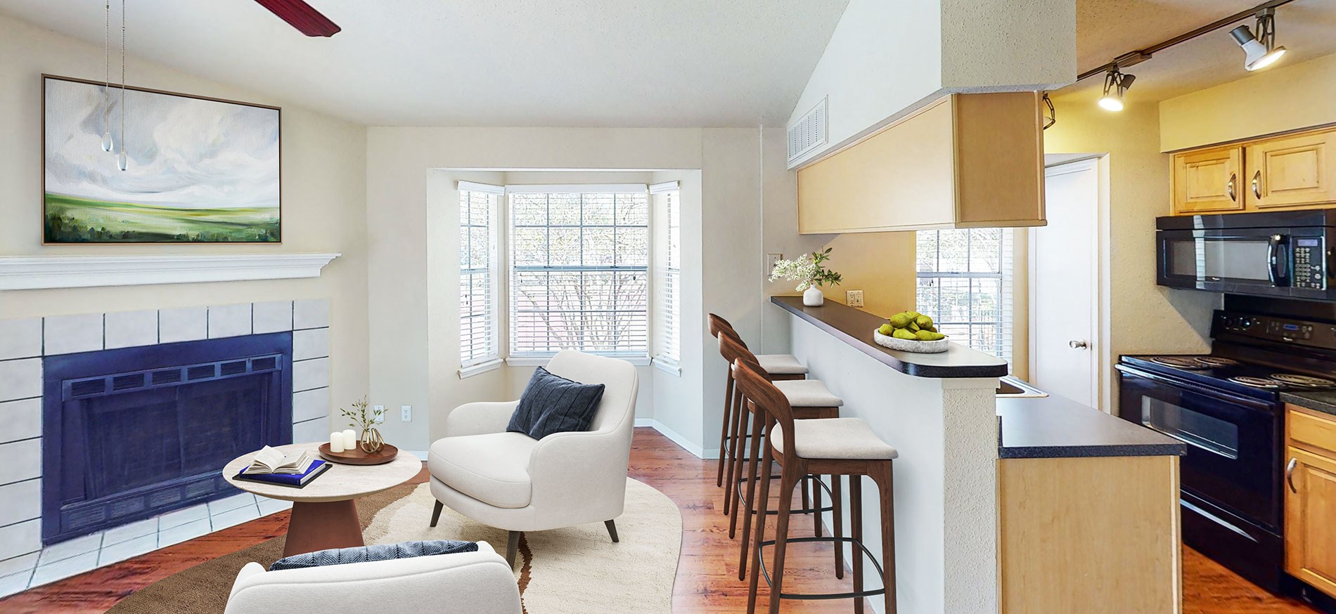 Lotus Landing apartments in Altamonte Springs, Orlando staged Living and Dining room featuring updated interior with fire place