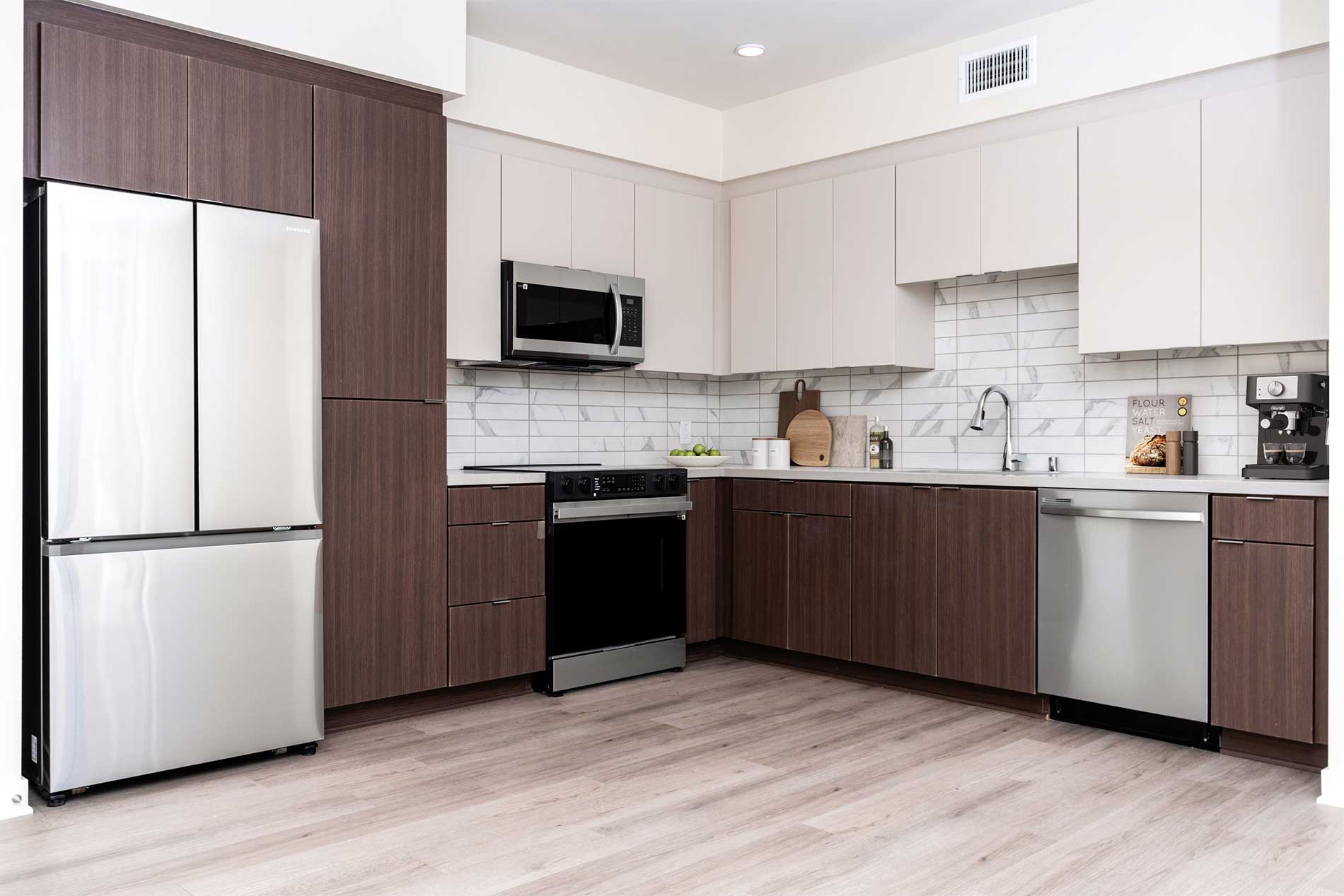 North Grove apartment kitchen with premium interiors, stainless steel appliances, and stylish finish package