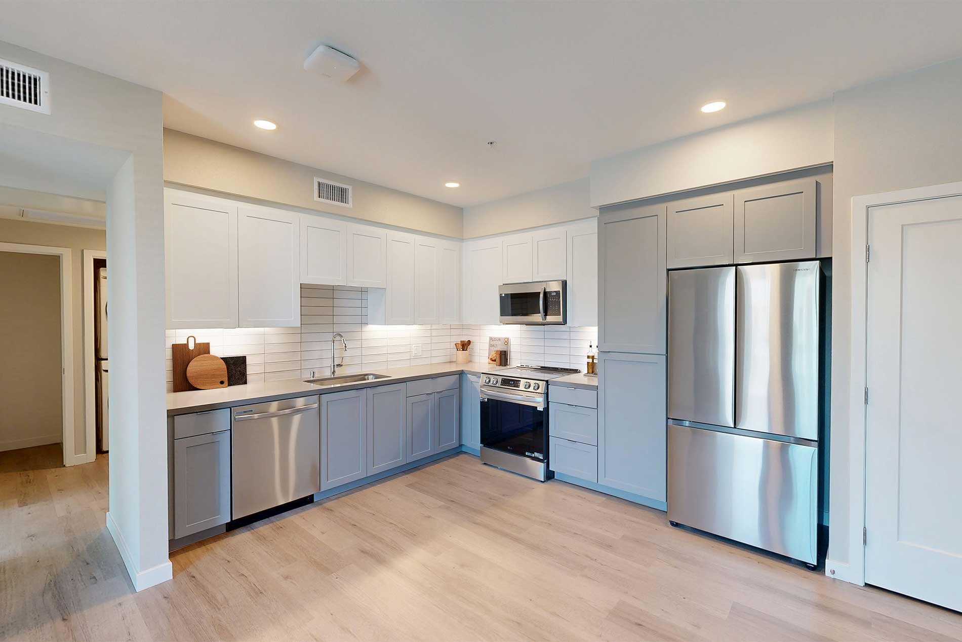 North Grove apartment kitchen with premium interiors, stainless steel appliances, and stylish finish package