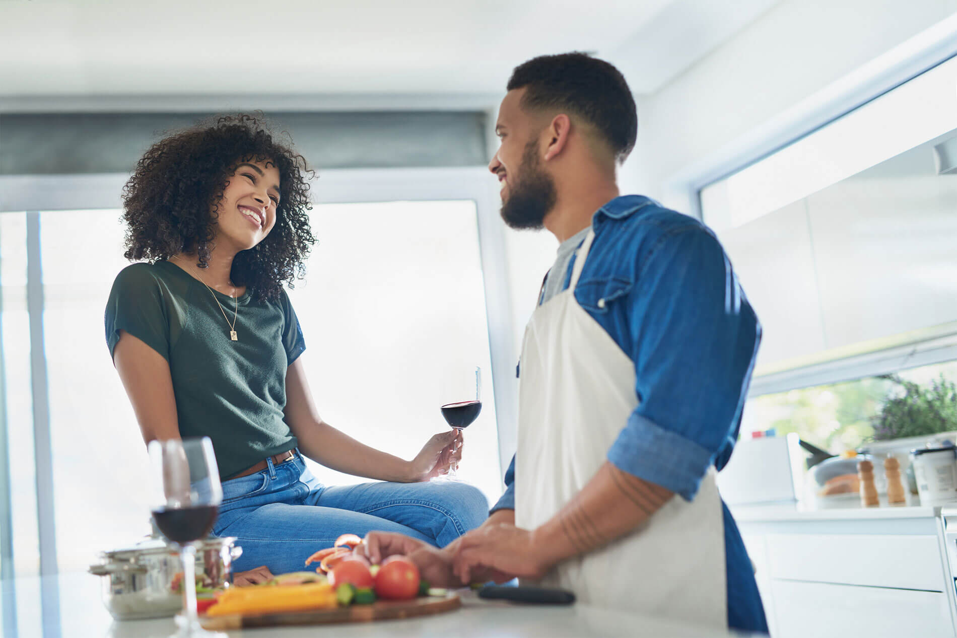 Happy young couple cooking in the kitchen