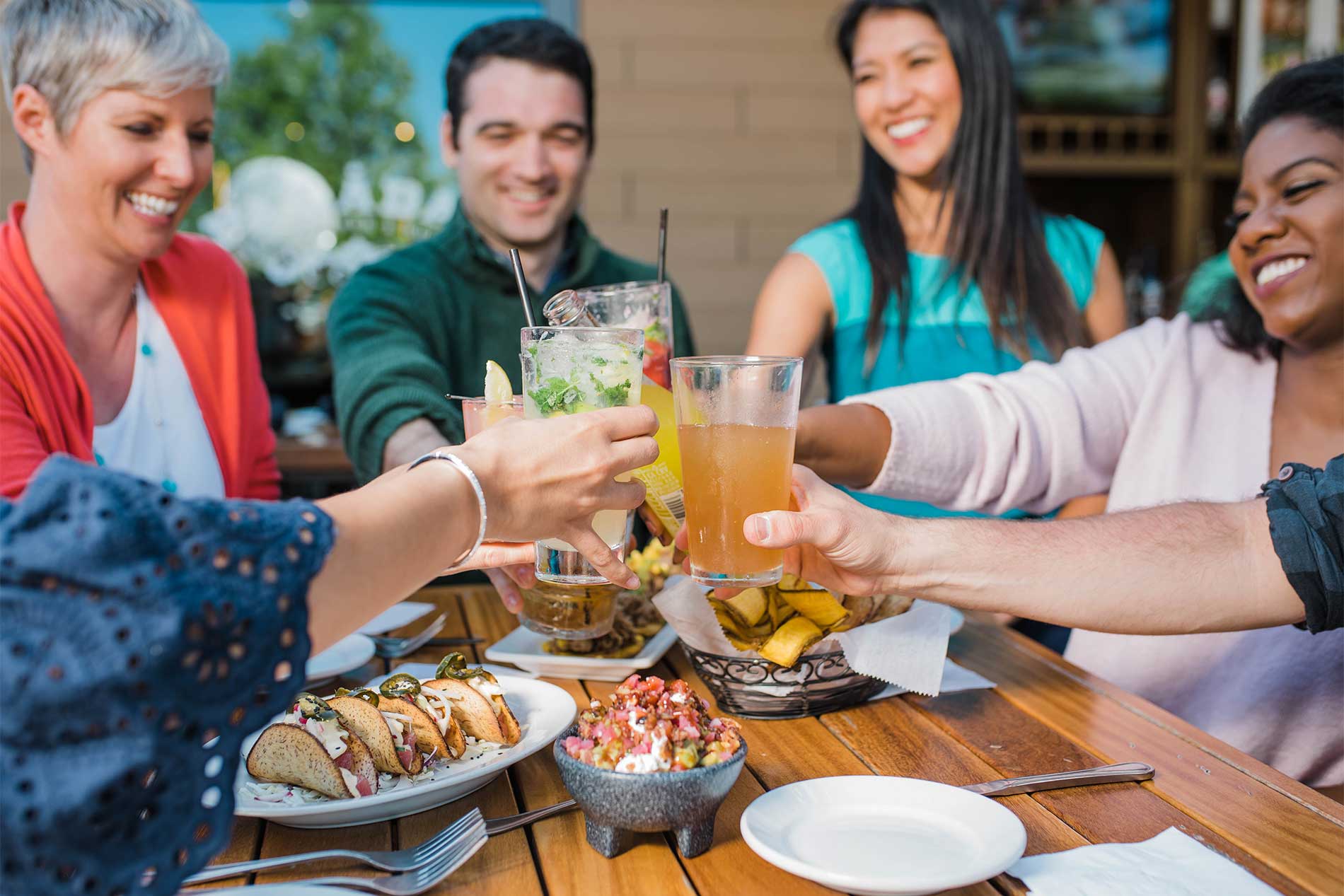 Friends toasting over food