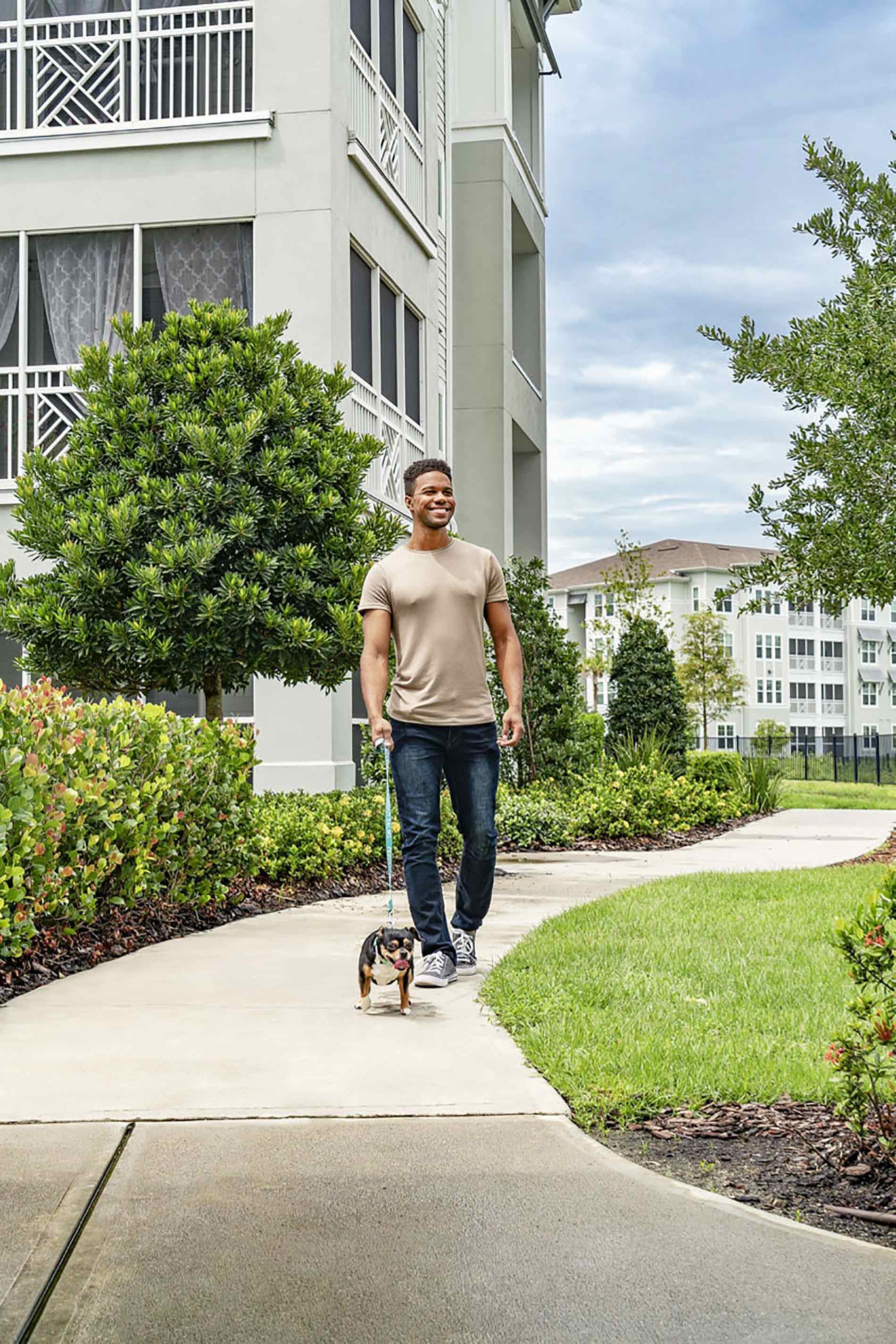 Peridot Palms Man Walking Dog