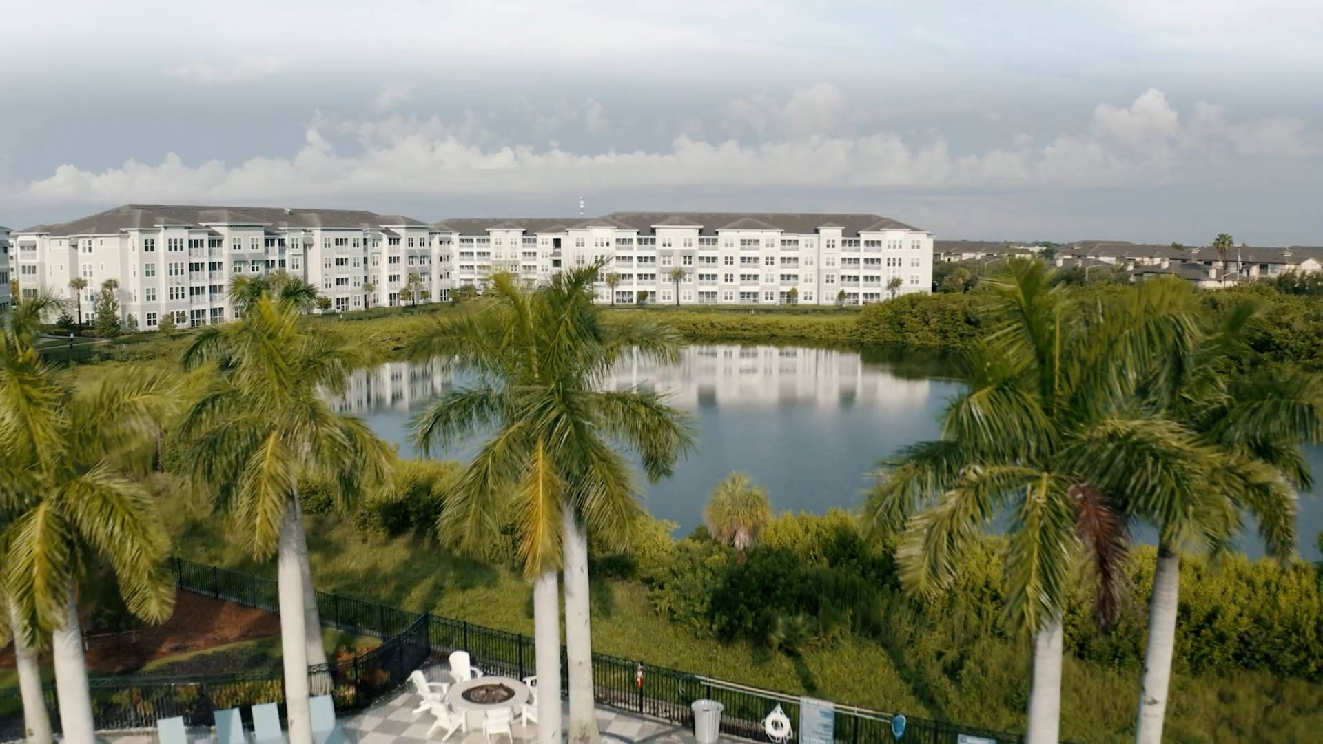 Peridot Palms drone building exterior and lake