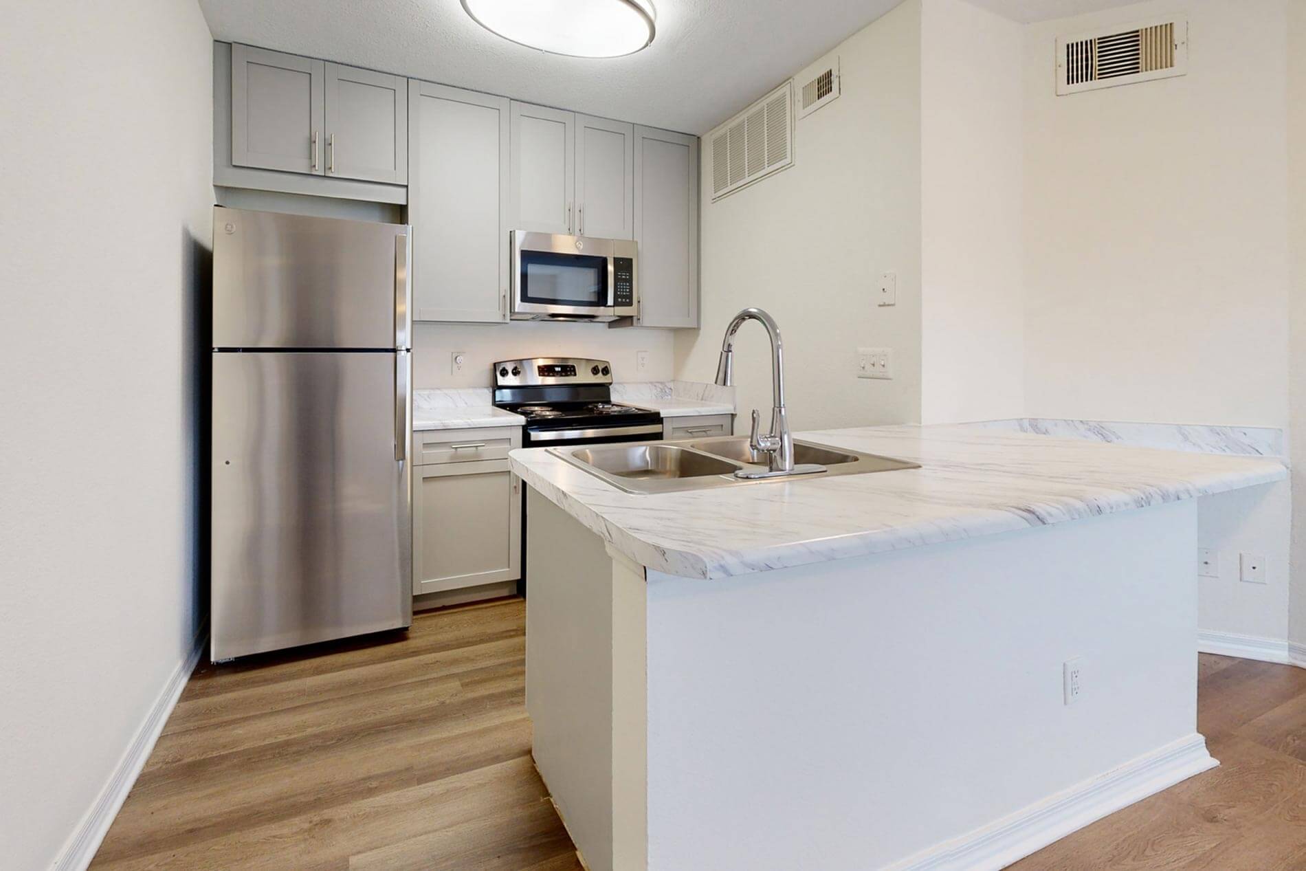 Polo Park apartment kitchen grey on white finish package
