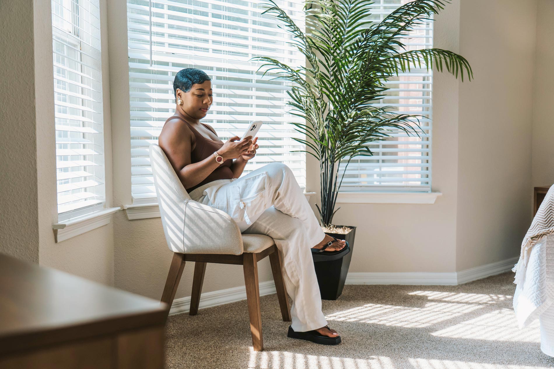 Polo Park woman sits in staged bedroom