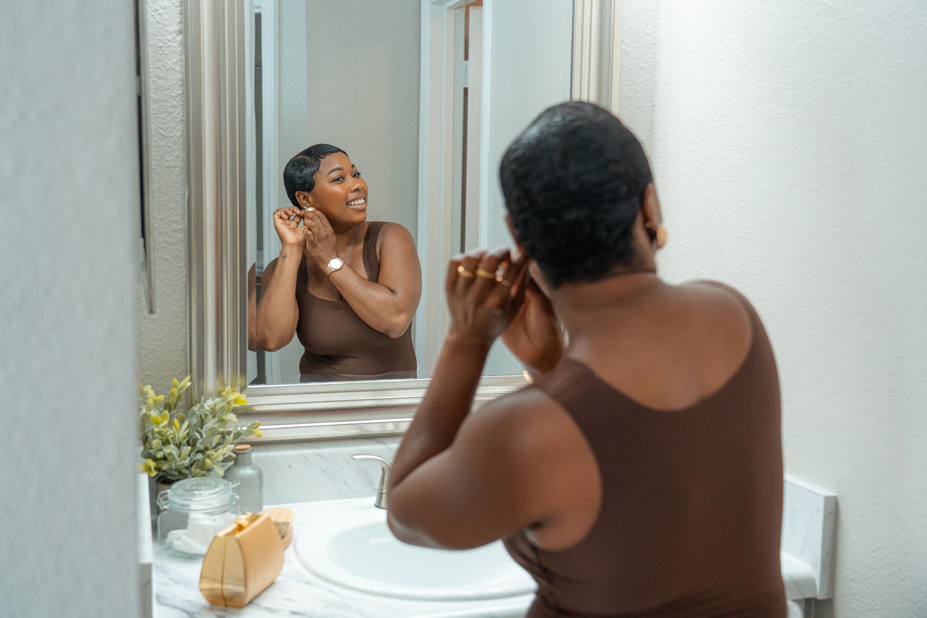 Polo Park woman gets ready in bathroom