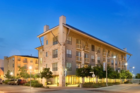 Residences At The Domain building exterior at night