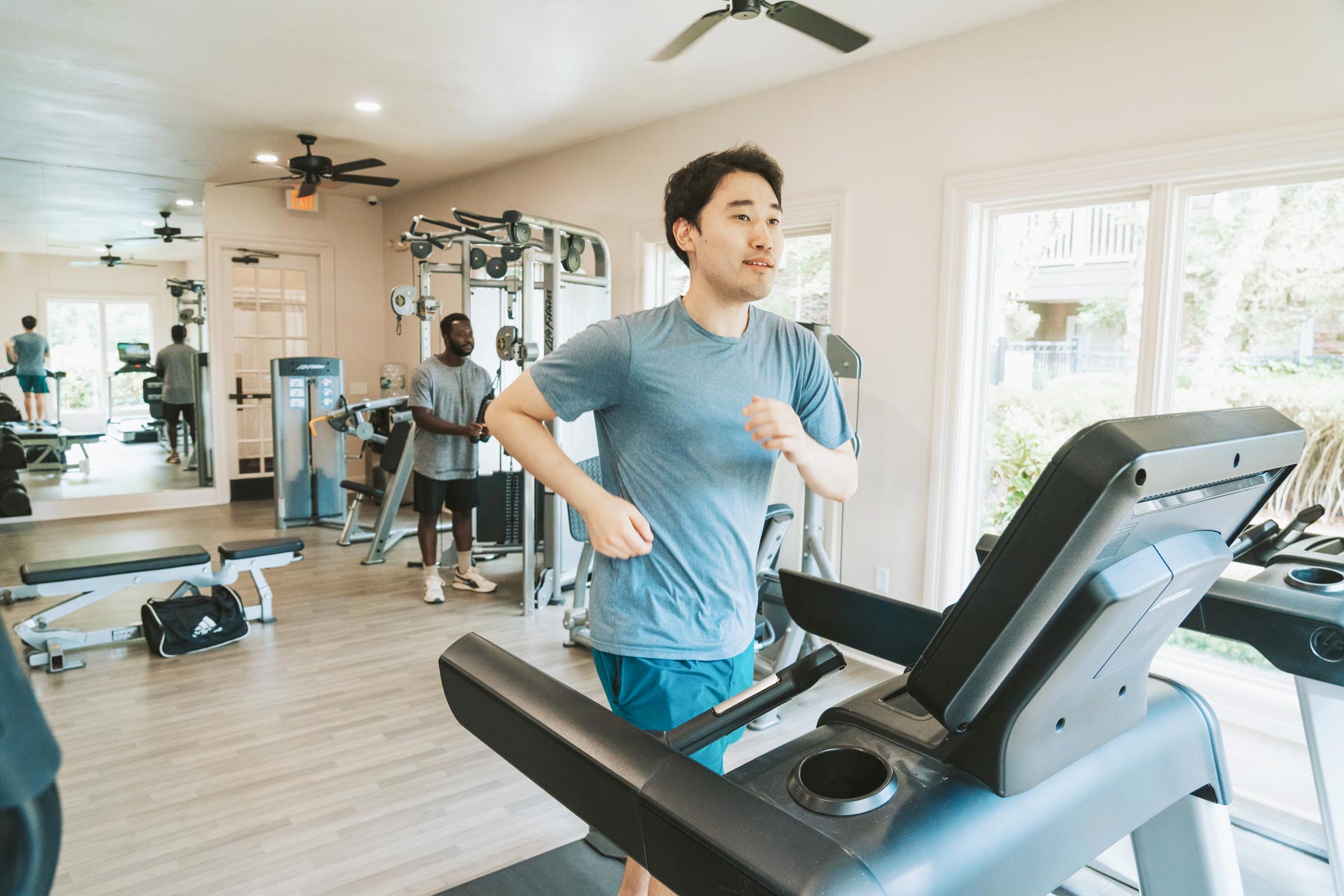 Ridge at Blue Hills two men exercise in gym