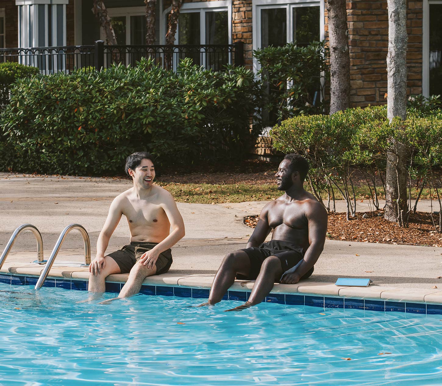 Ridge at Blue Hills two men by pool