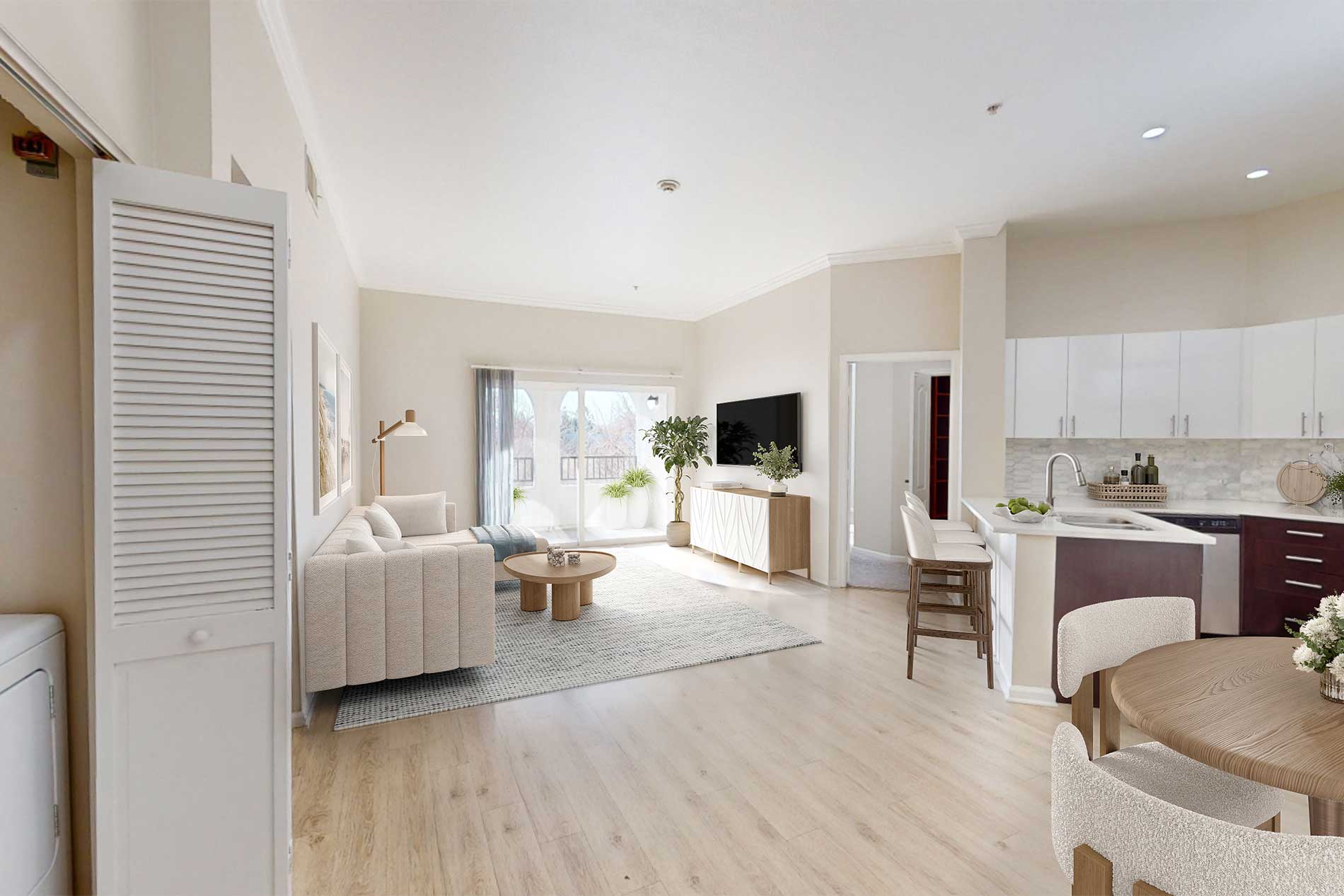 Open-concept kitchen and living room inside an updated apartment home at River Terrace in Santa Clara.