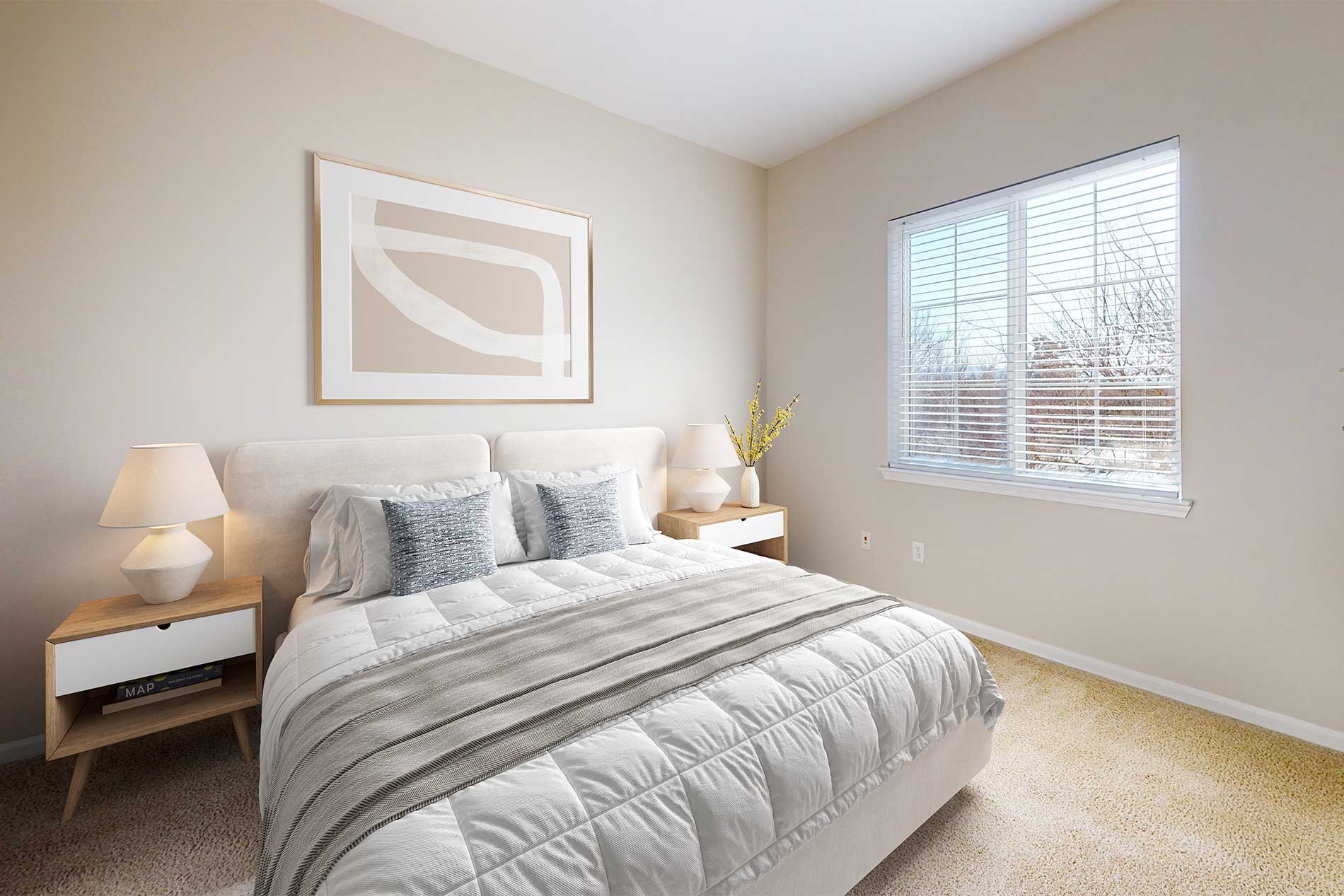Bright bedroom inside a renovated apartment home at River Terrace in Santa Clara, CA.