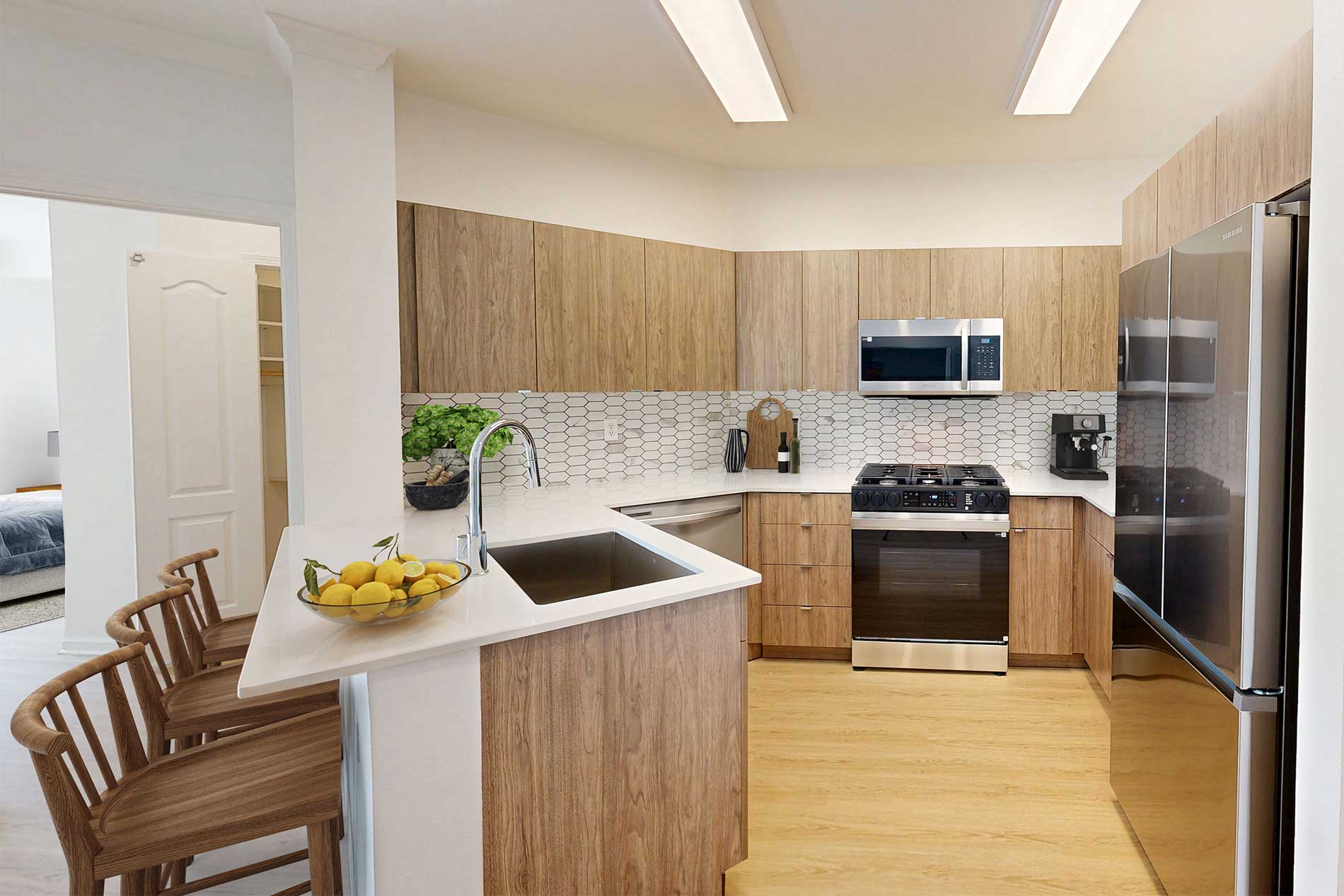 Contemporary kitchen and living space at River Terrace apartments in Santa Clara.