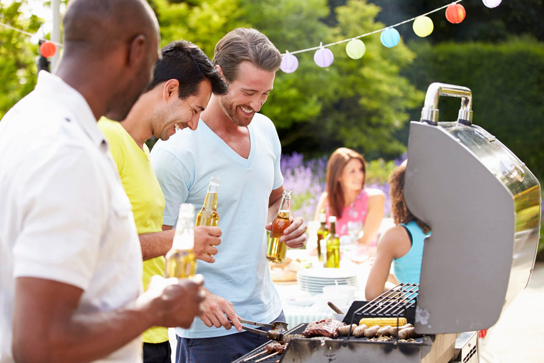 Friends BBQing at the grill