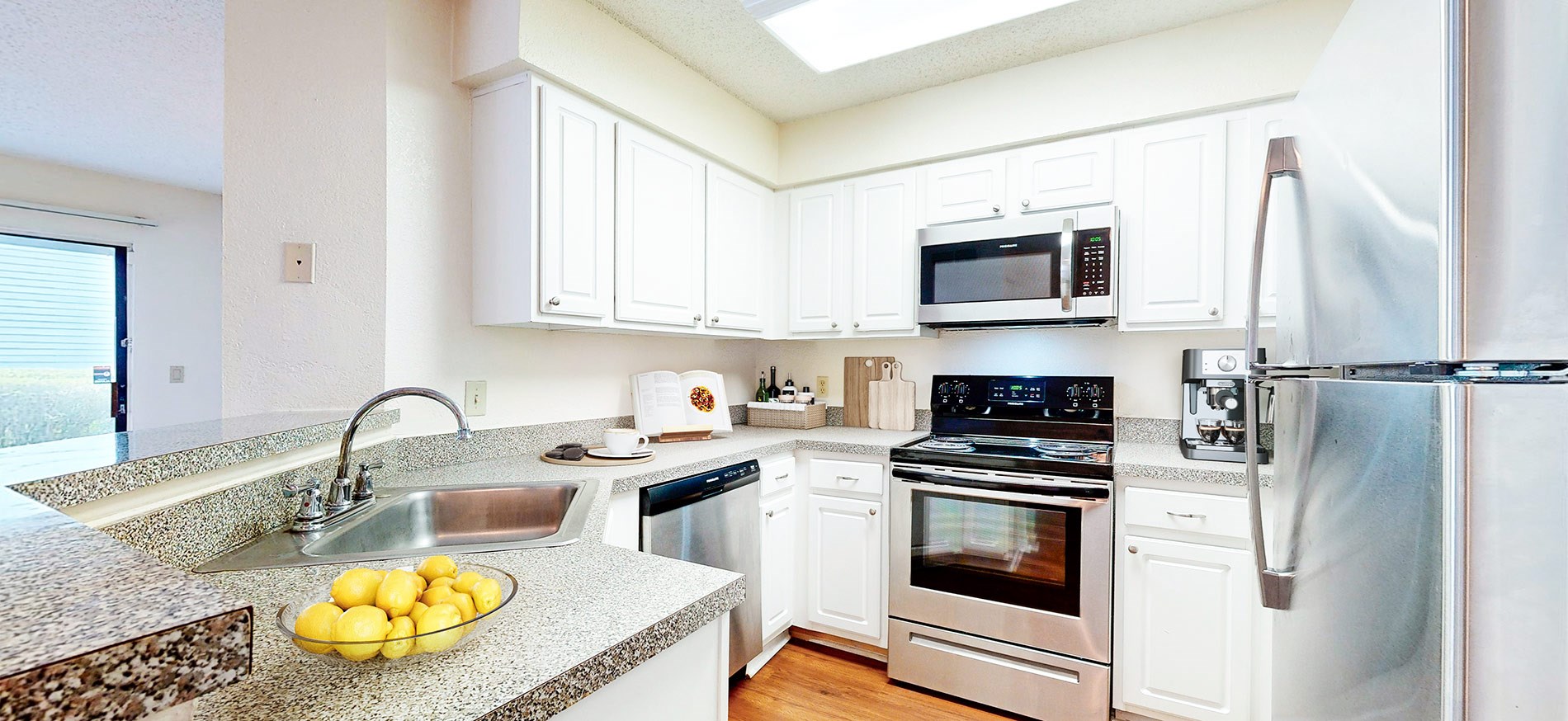 An upscale Seabrook apartment with stainless steel appliances and wood plank flooring located in the Southeast Winter Park neighborhood of Orlando