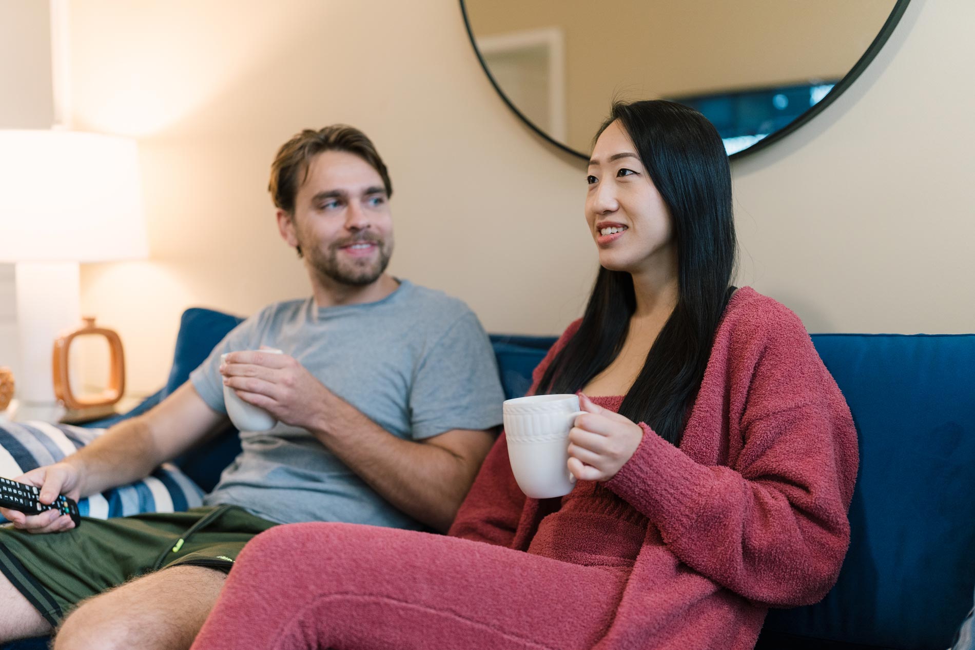 Signal Hill couple sits on couch with coffee