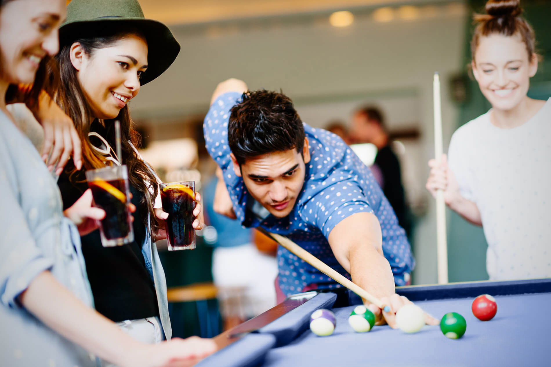 Friends playing billiards 