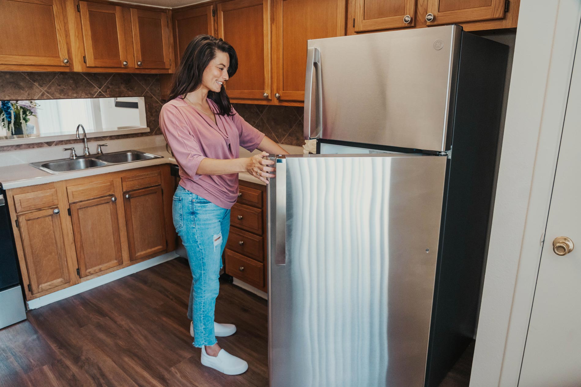 Summit West woman looks in refrigerator