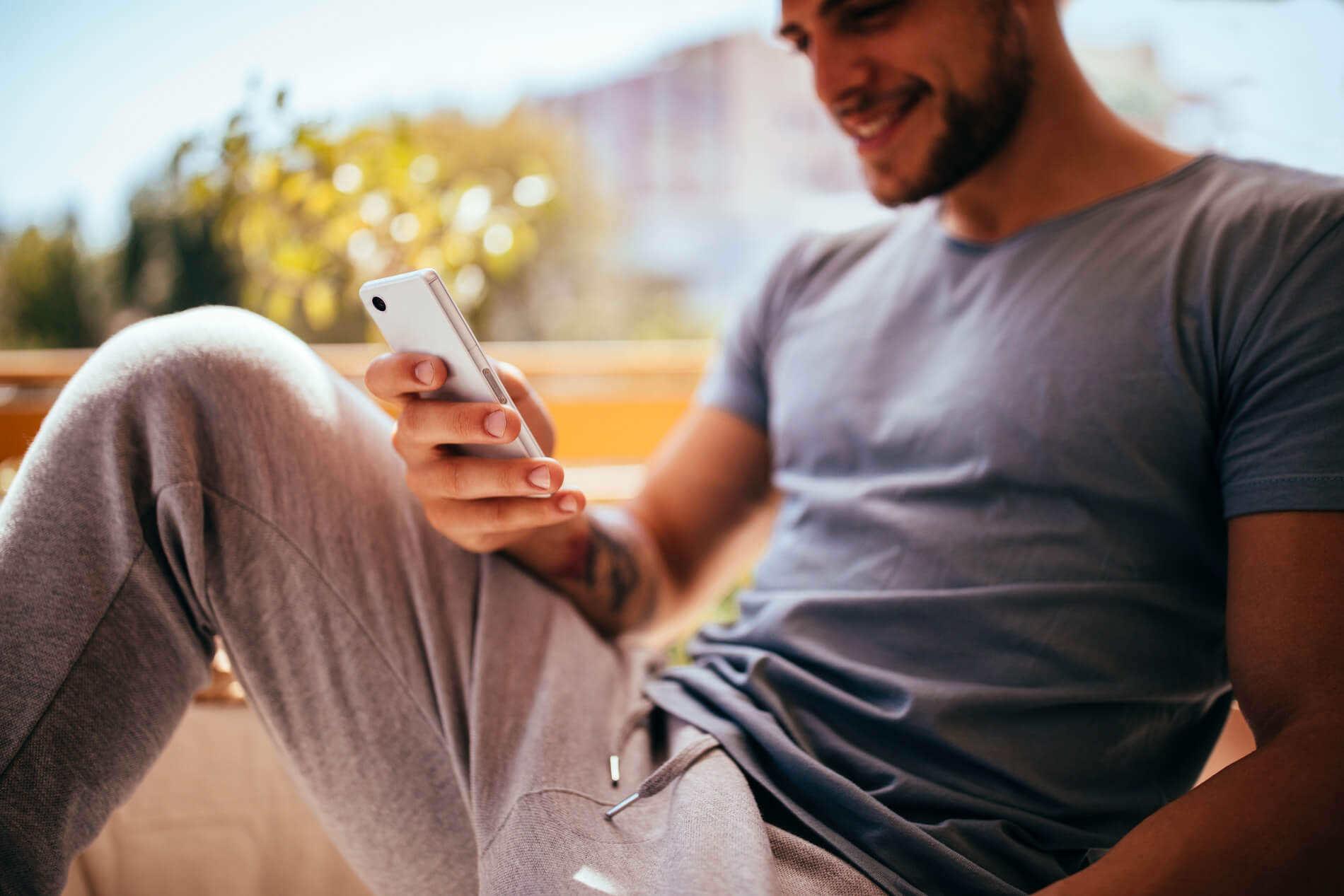 Man sitting looking at his phone