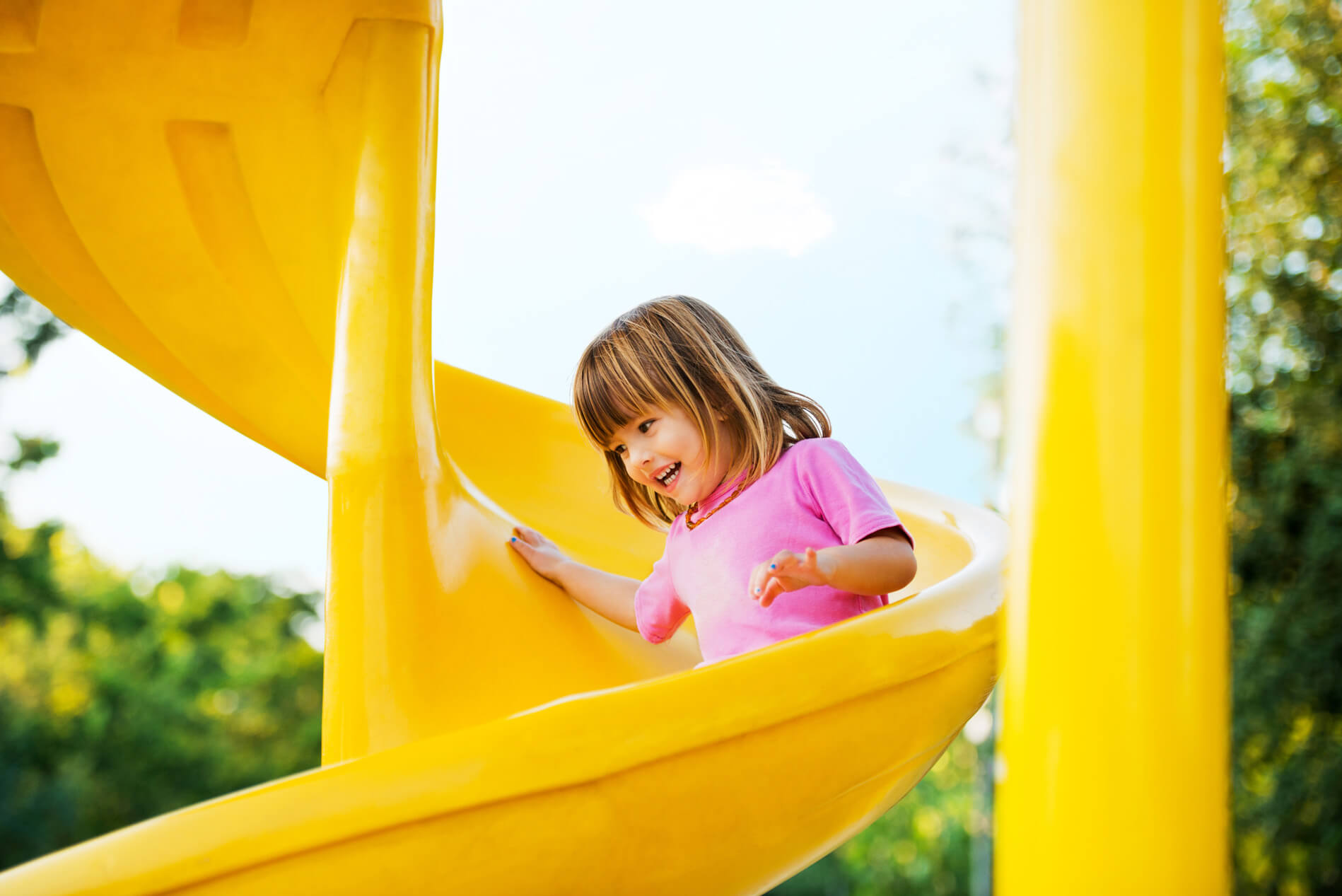 Child sliding down a slide