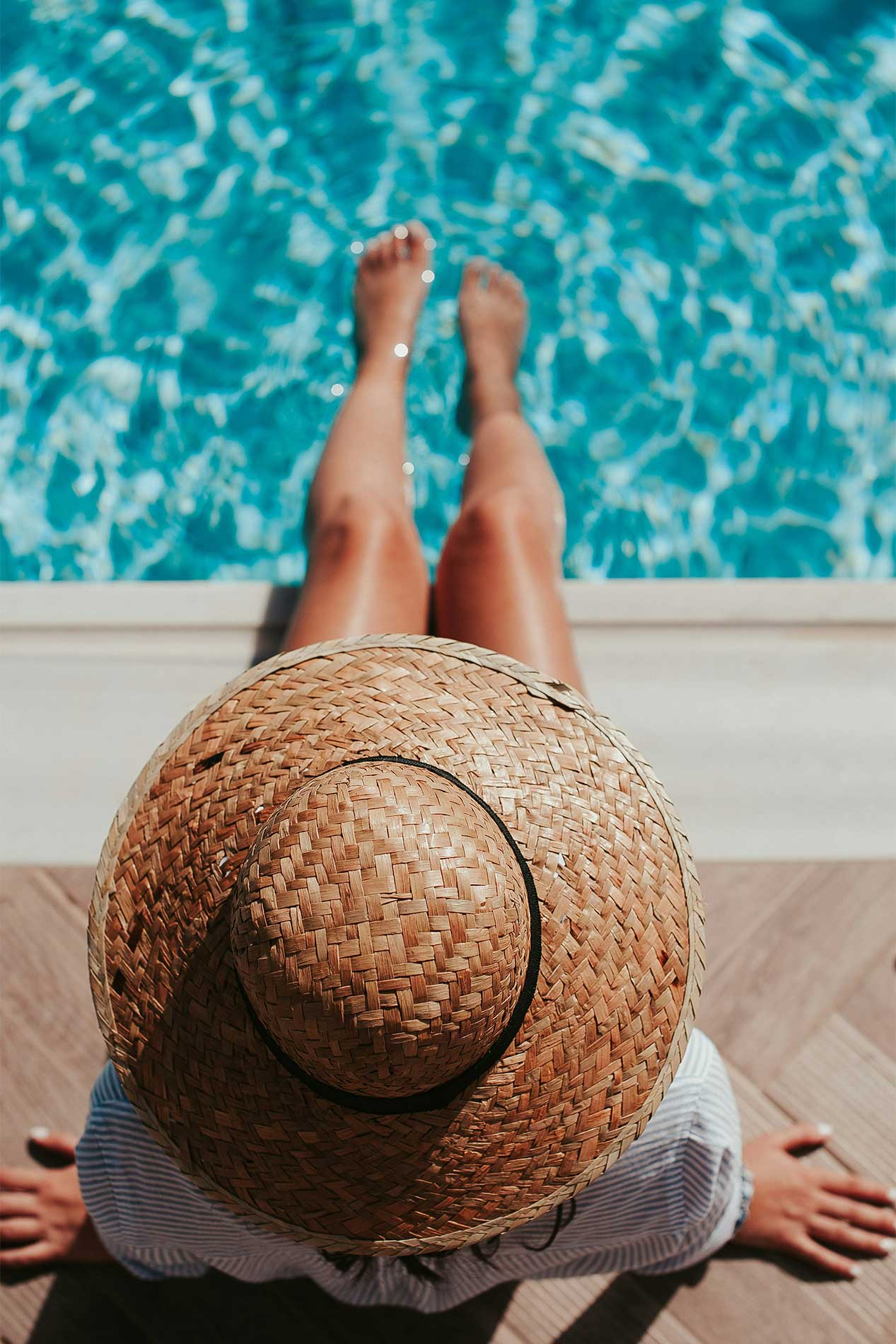 Woman by swimming pool
