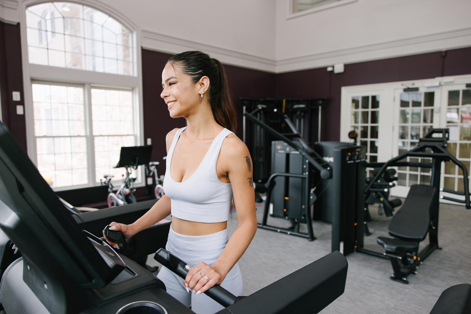 Courts At Dulles woman on treadmill in gym