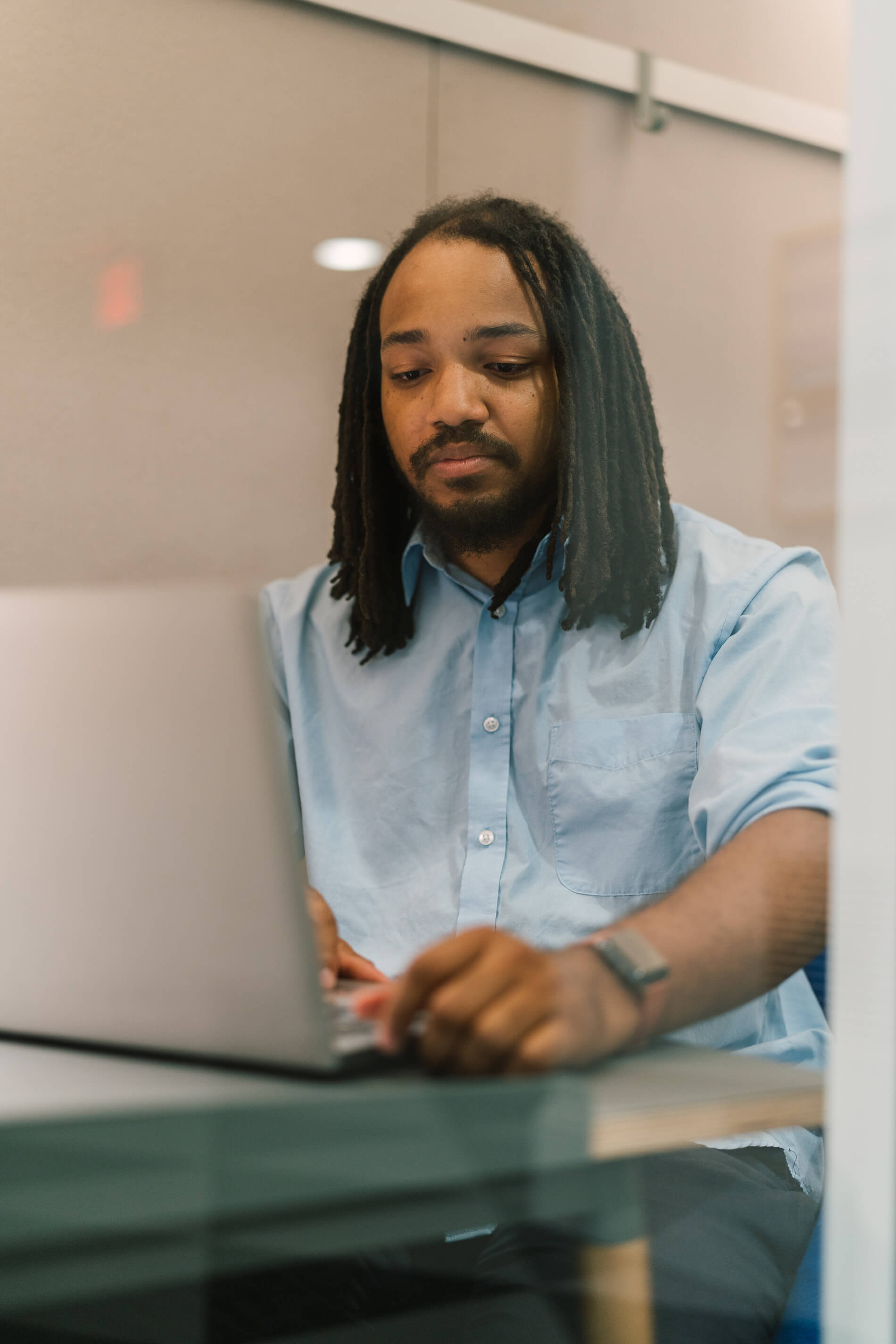 Courts At Huntington man works in co-working space