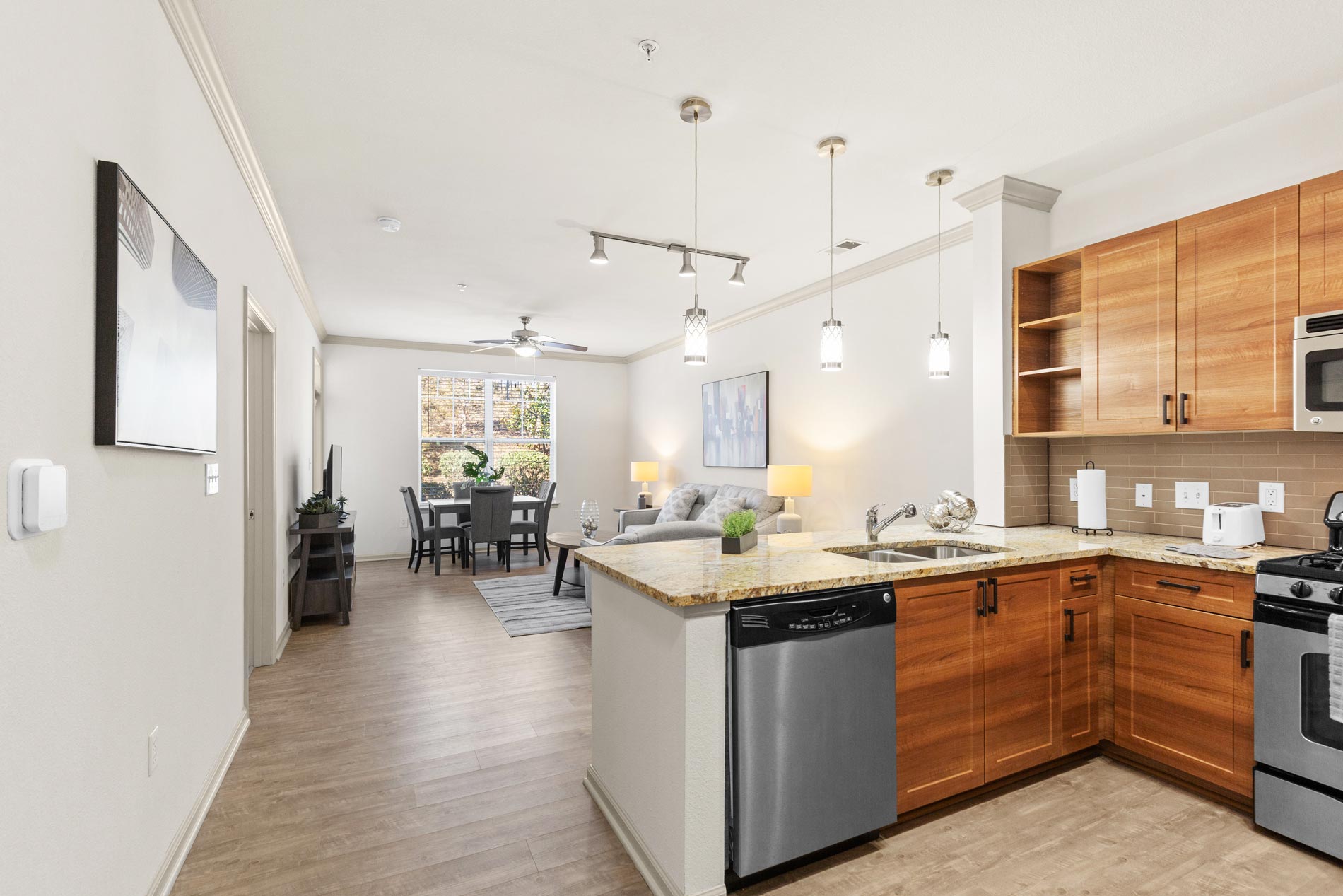 The Enclave staged kitchen and living room