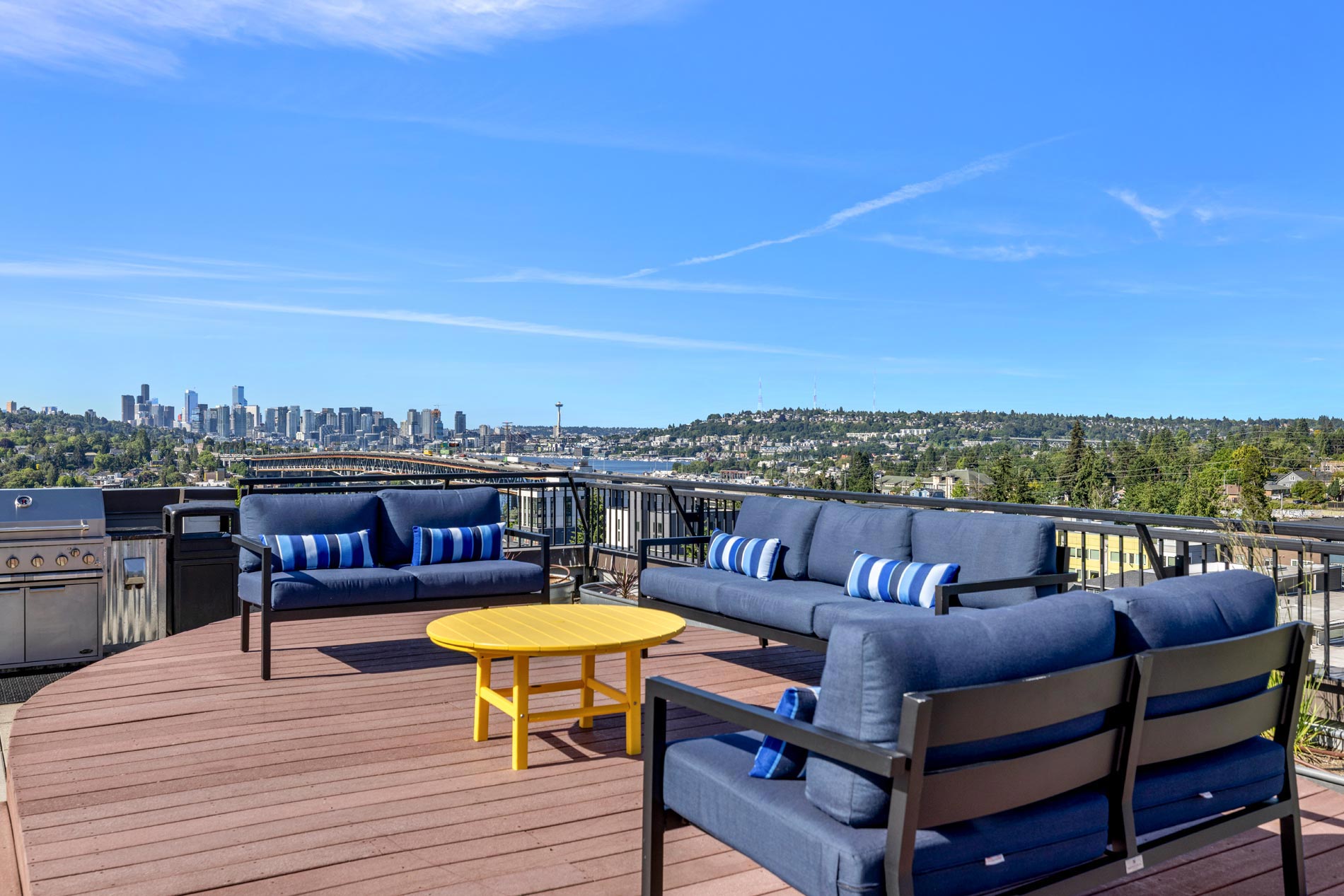 The Kennedy building rooftop lounge with firepit and grilling area