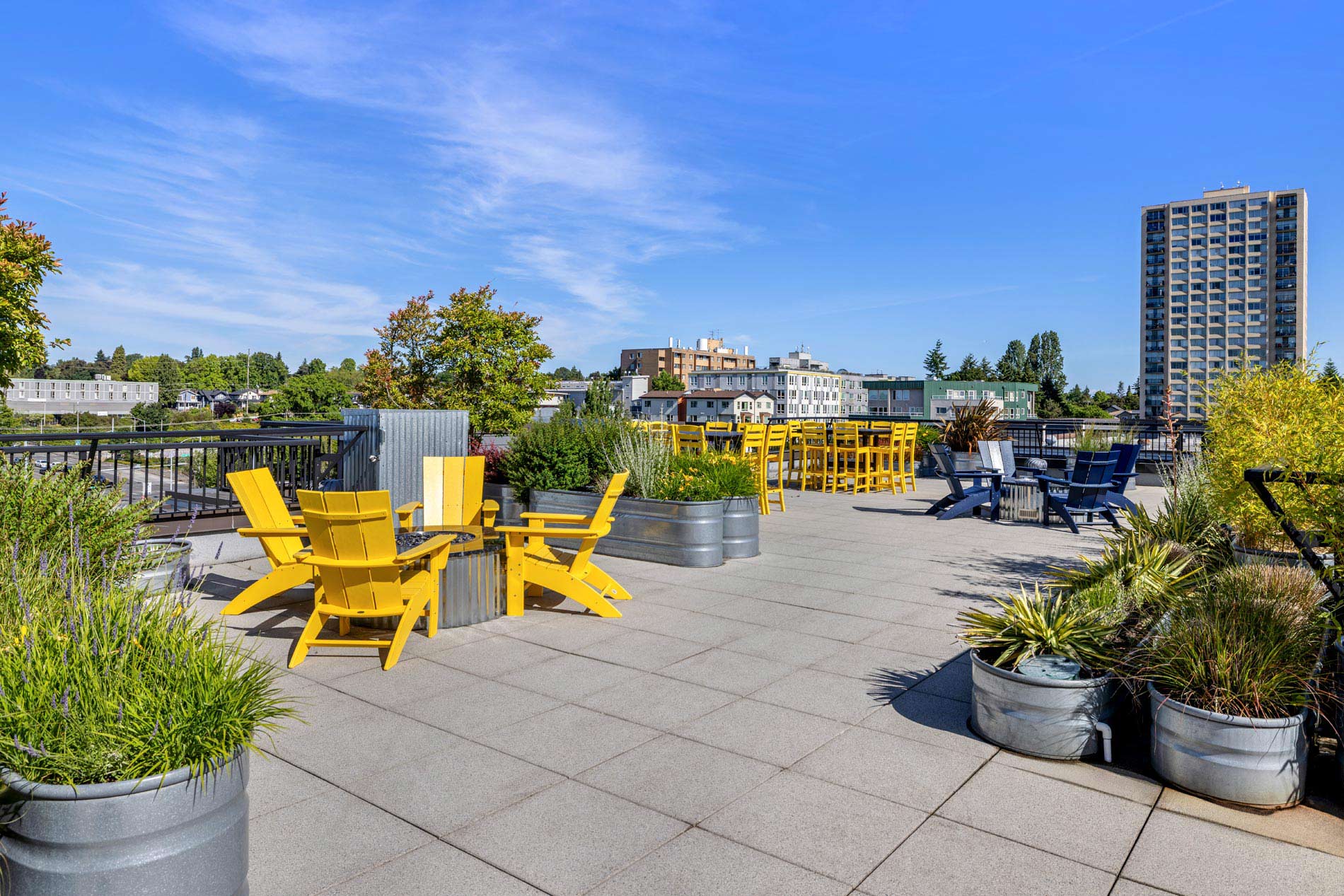 The Kennedy building rooftop lounge with firepit and grilling area
