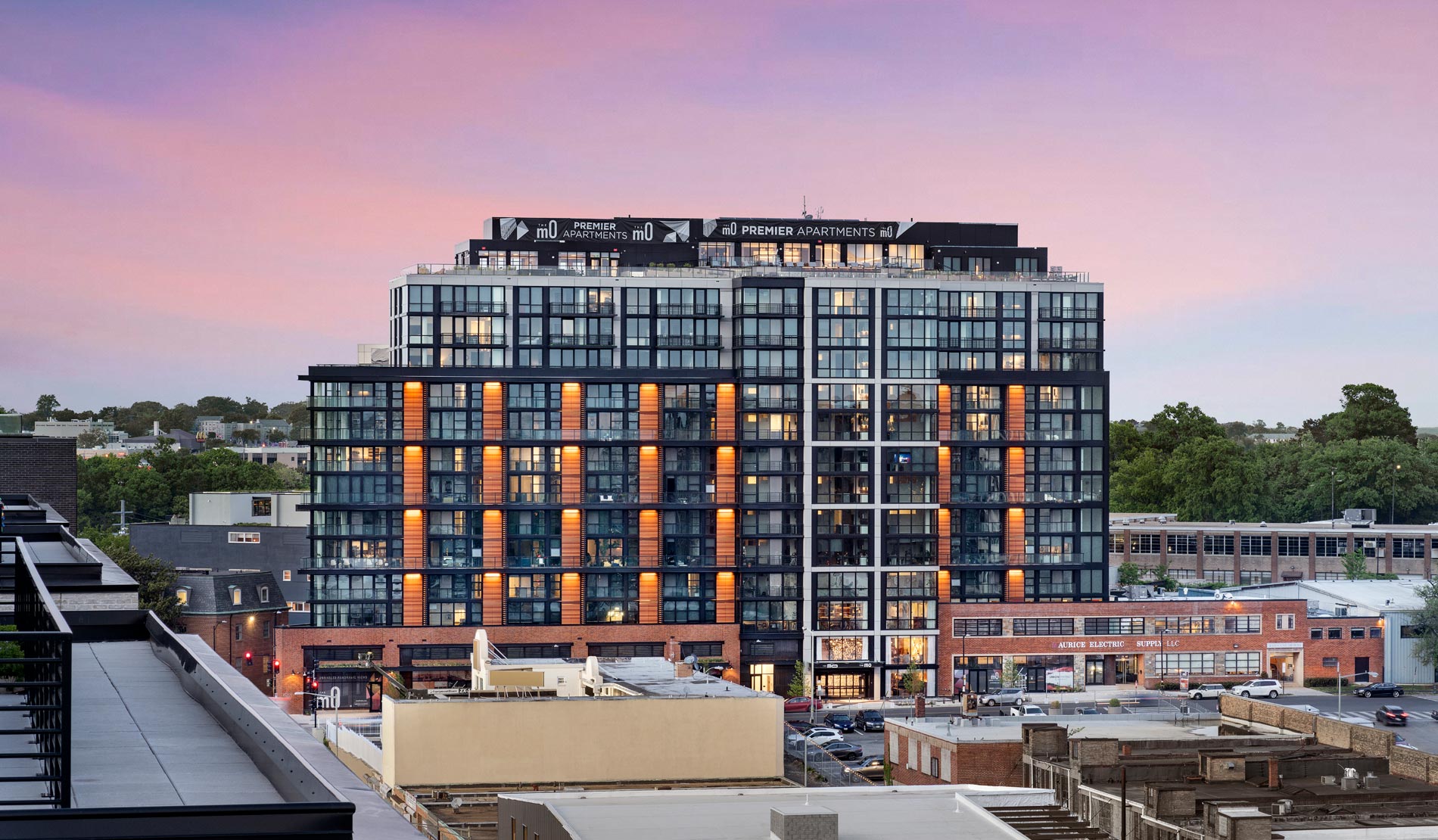 The MO Building exterior at sunset