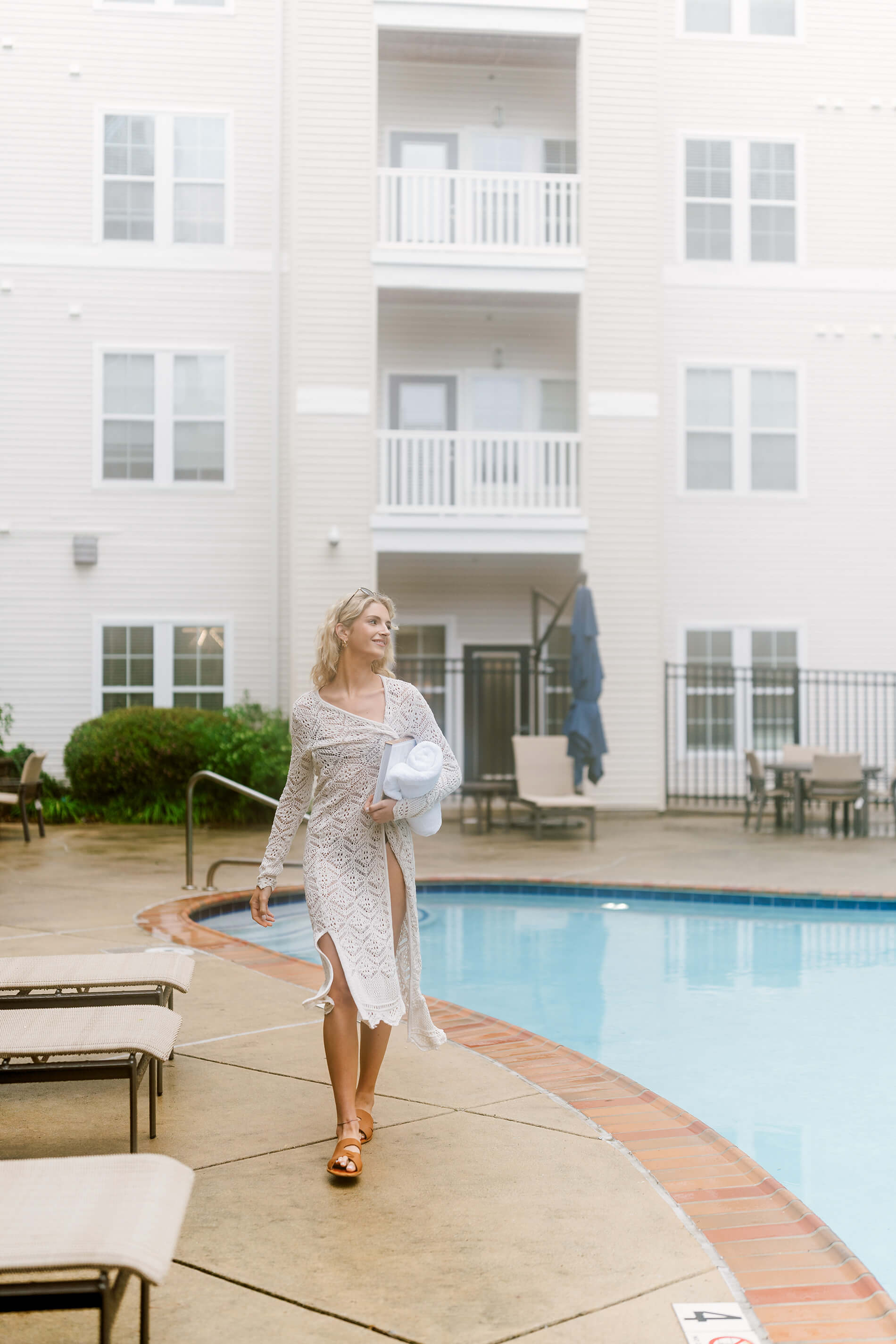 Quarters at Towson Woman walks by pool