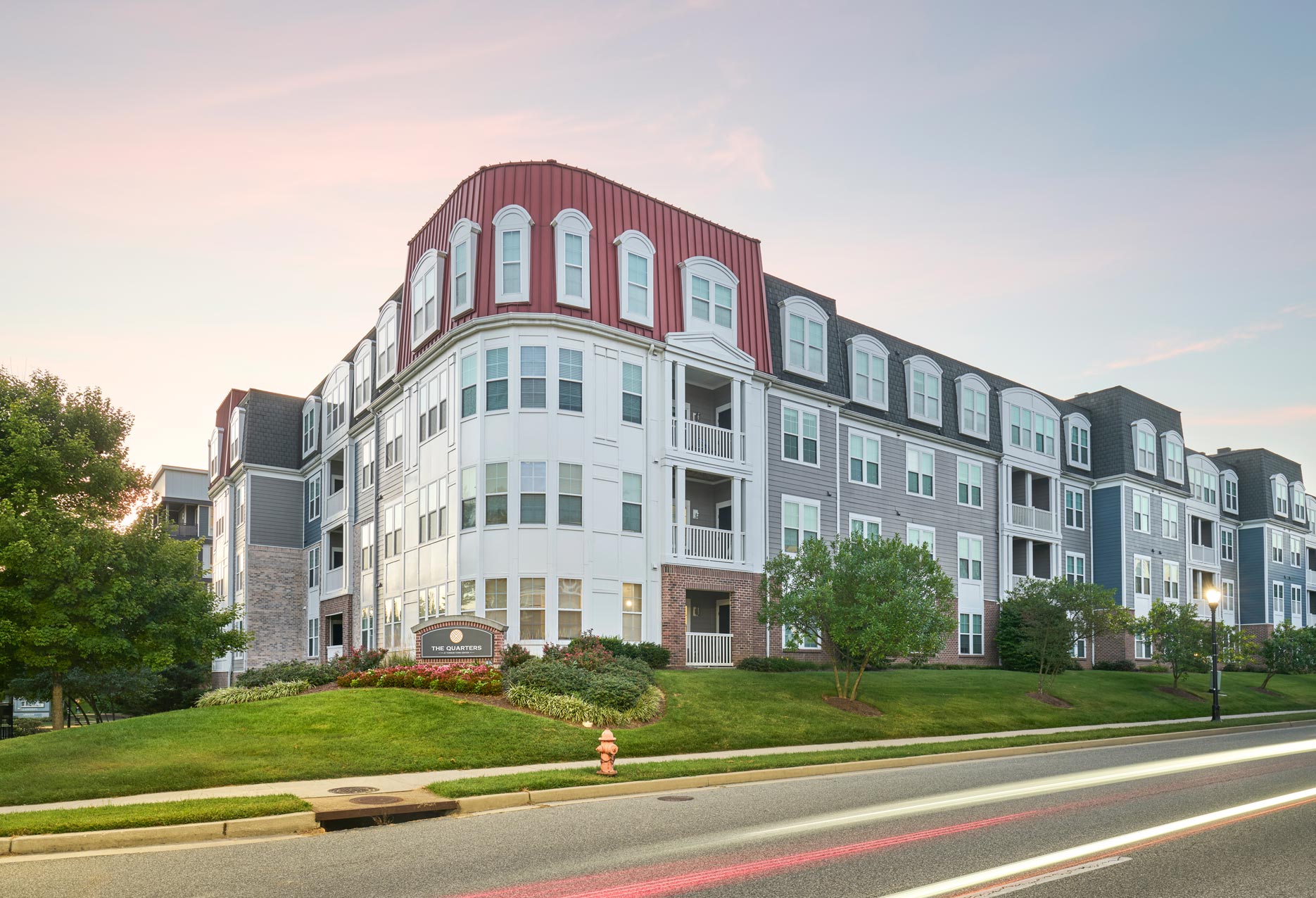 Quarters at Towson building exterior at sunset
