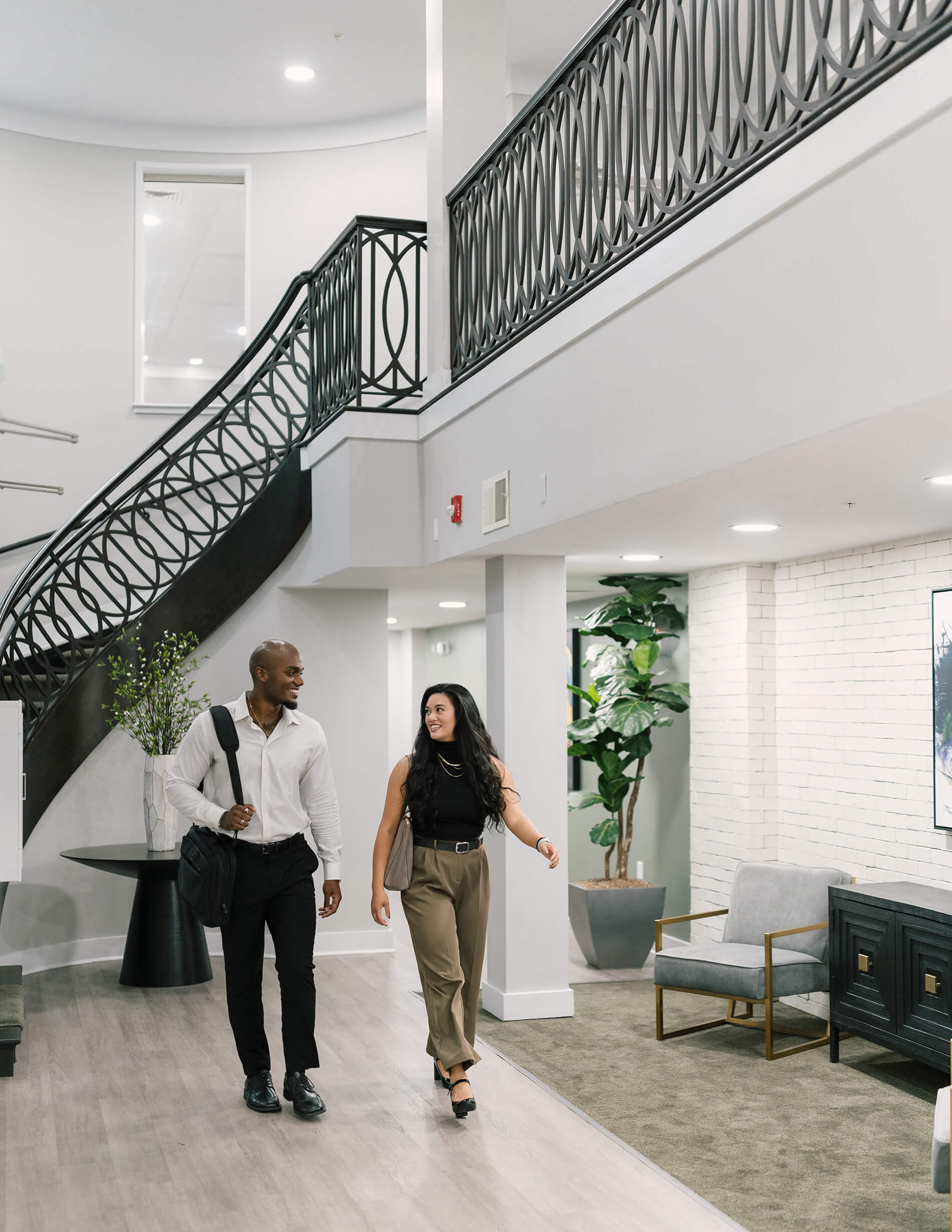 Quarters Towson man and woman walk through lobby