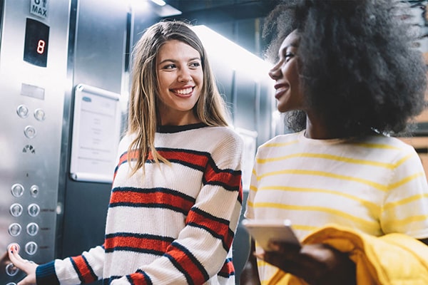 2 women in an elevator 2 women in an elevator