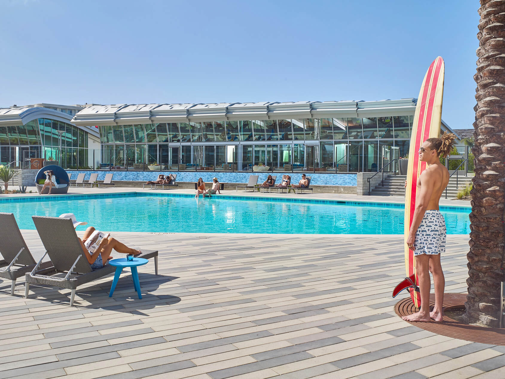 Person standing next to the pool