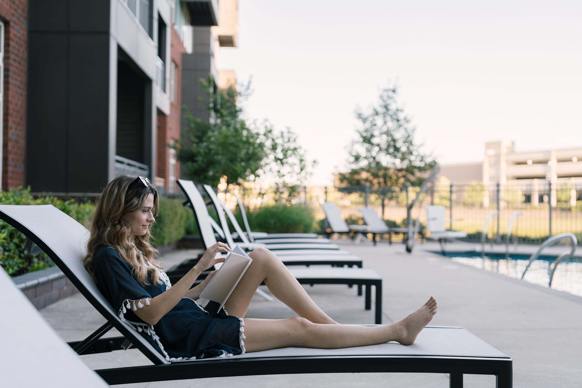 The Smith woman sits by pool