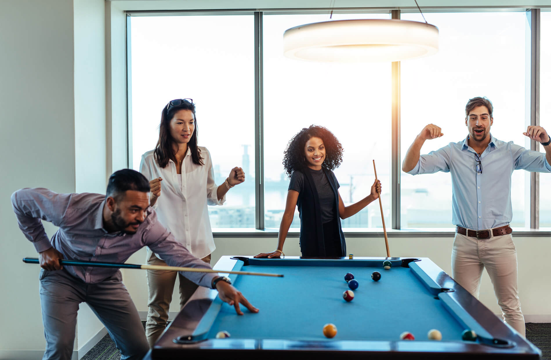 Friends playing billiards 