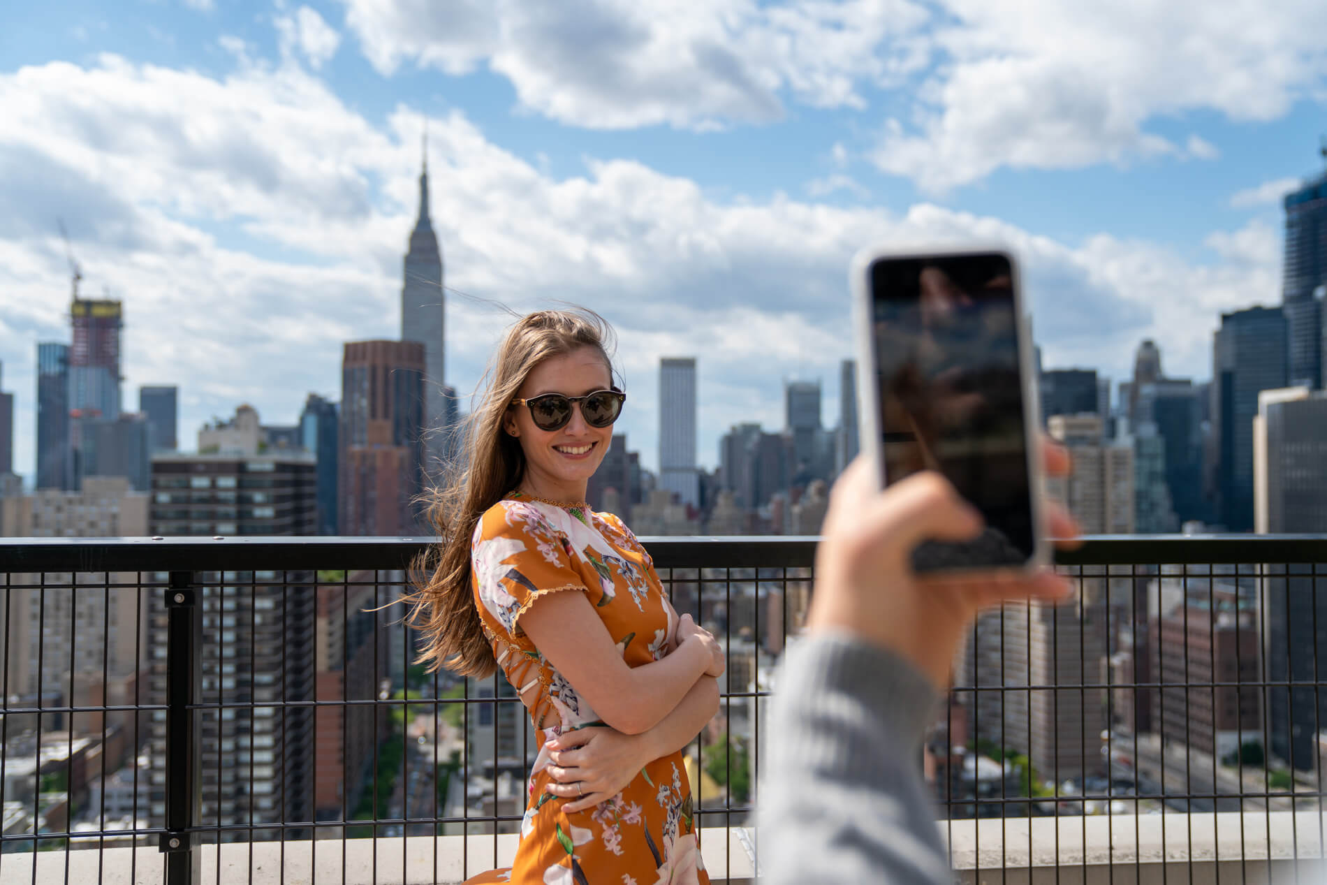 Person taking a photo of a friend