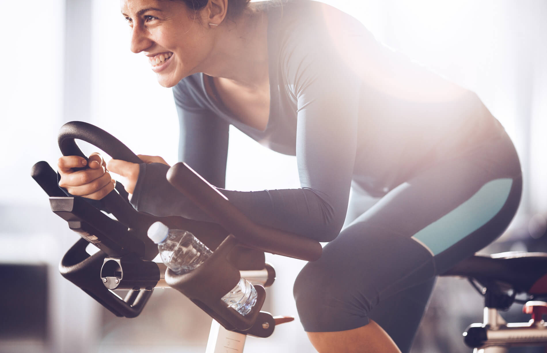 Villas at Fiori woman smiling on treadmill