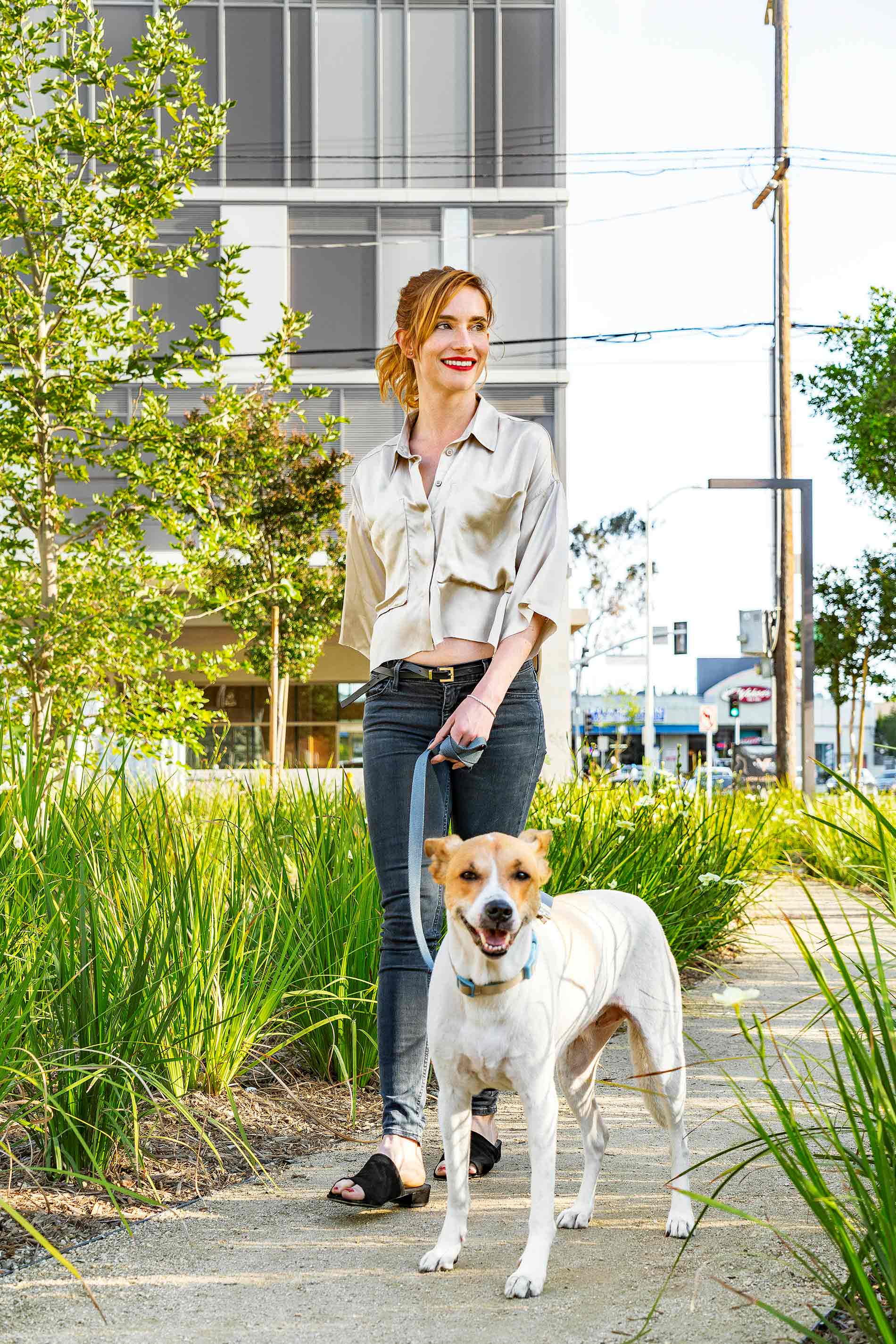 Woman walking her dog outside