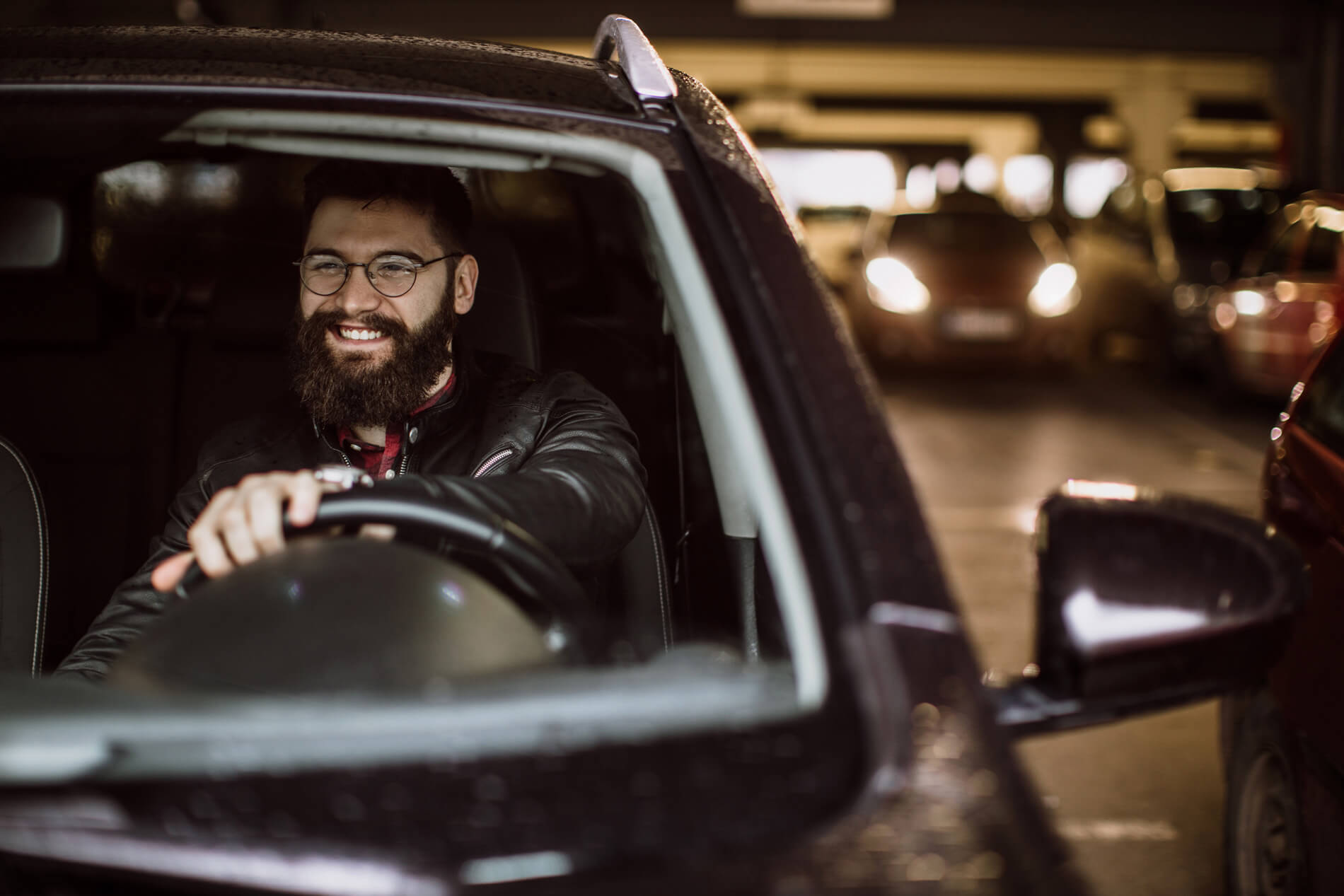 Man driving in a parking garage