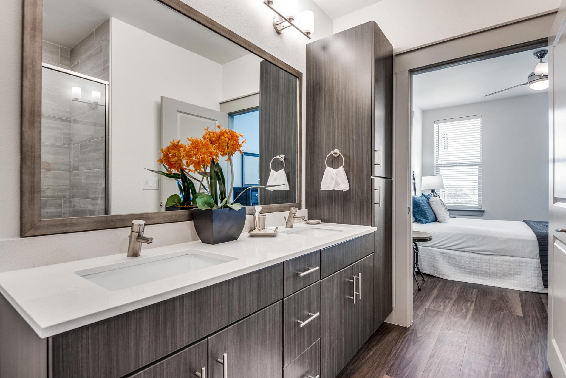 Vitruvian West Staged Bathroom With Bedroom in Background