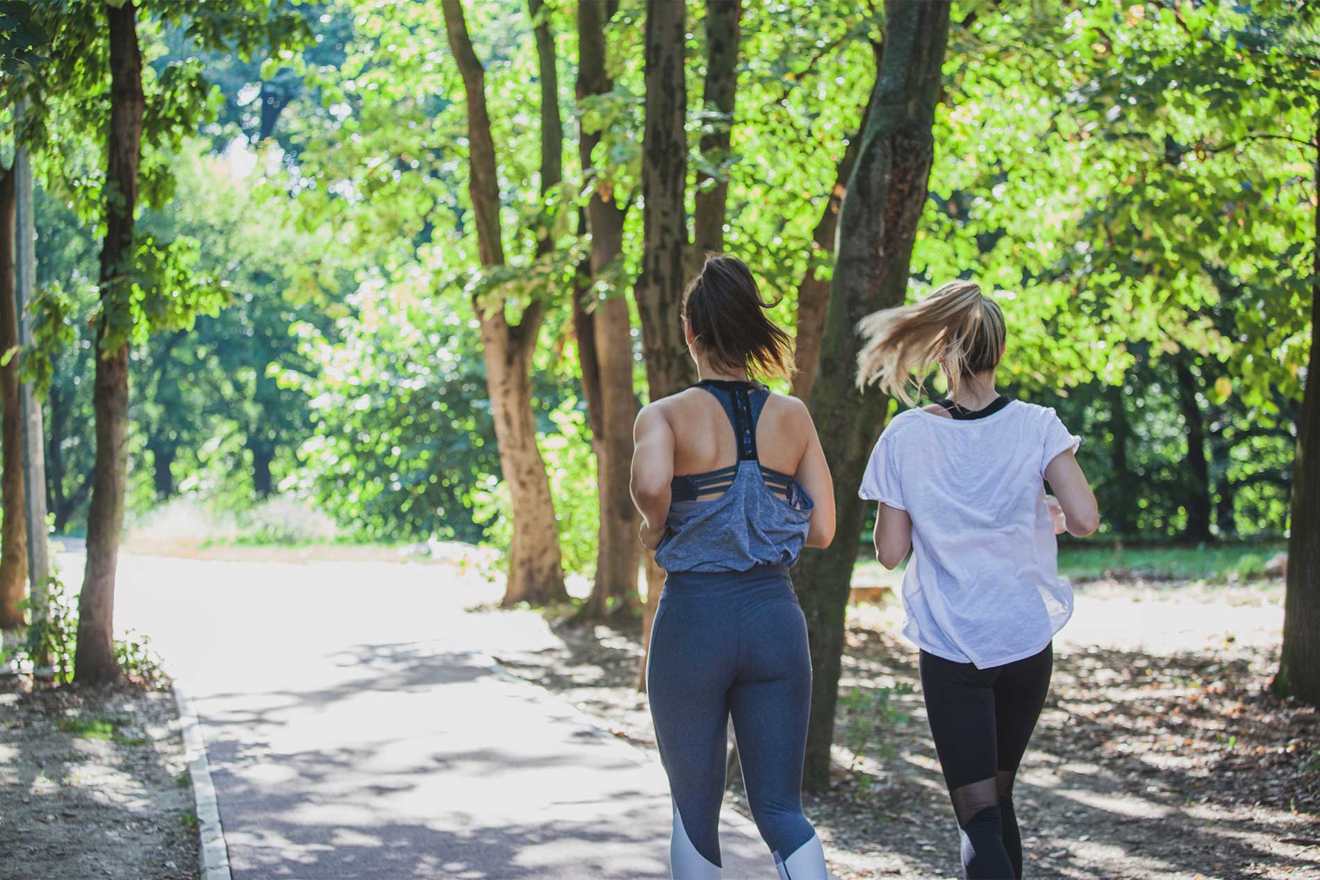 Two women running in the park