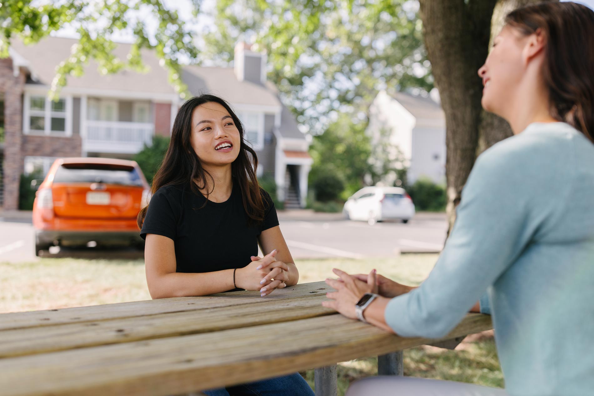 Wellington two woman sit at picnic table